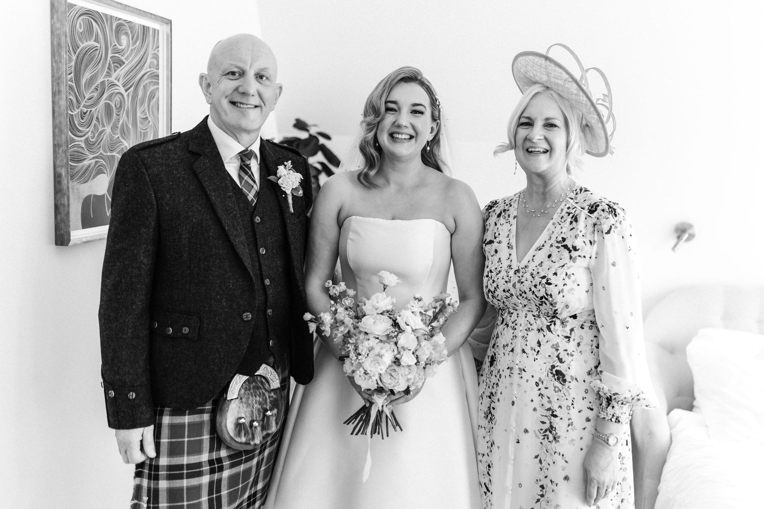 Wedding bride getting ready with parents Virgin hotel in Edinburgh City Scotland