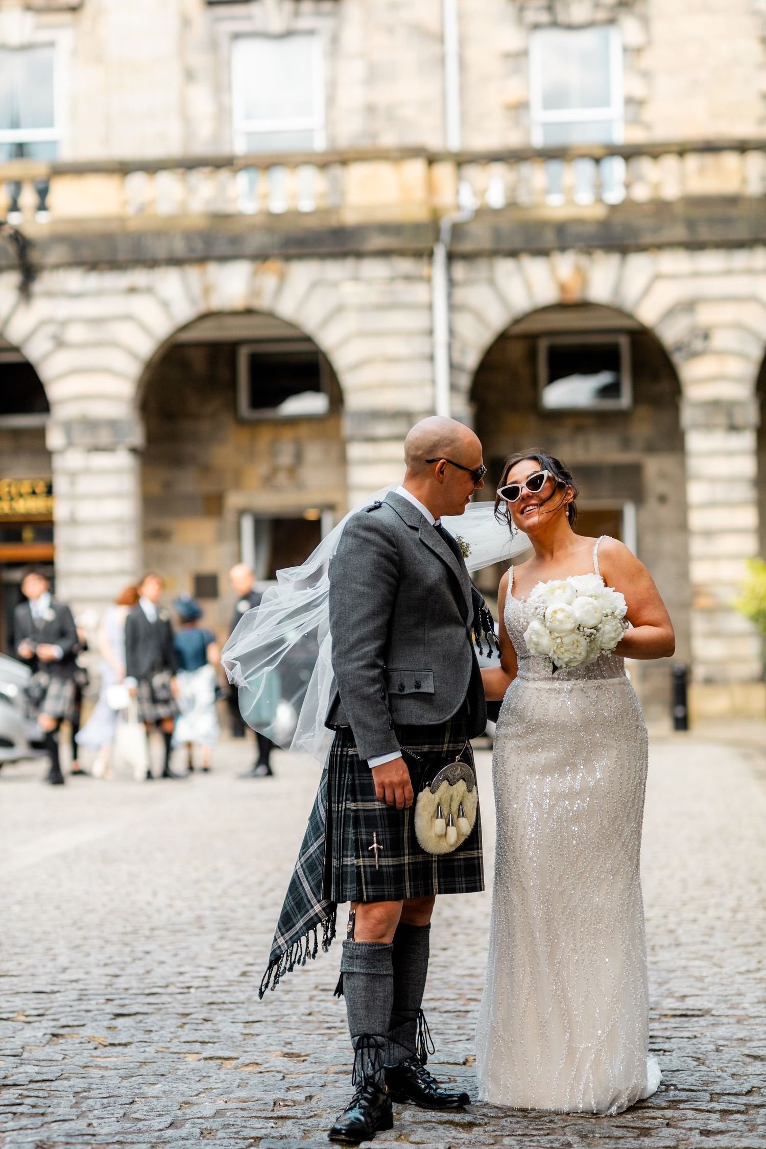 Bride and groom romantic outside City Chambers wedding in Edinburgh, Scotland,