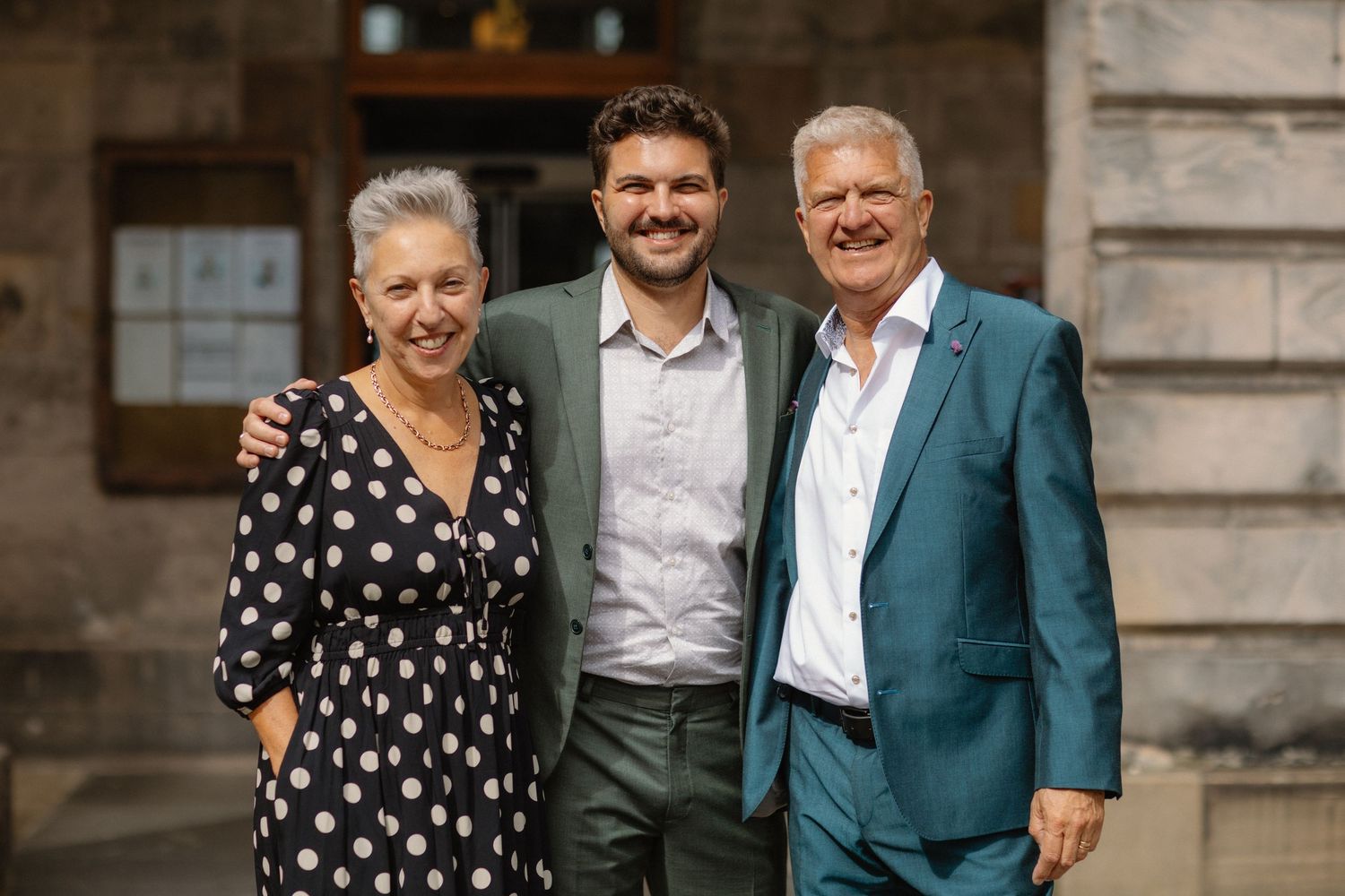 outside the Edinburgh City Chambers 
Groom with parents