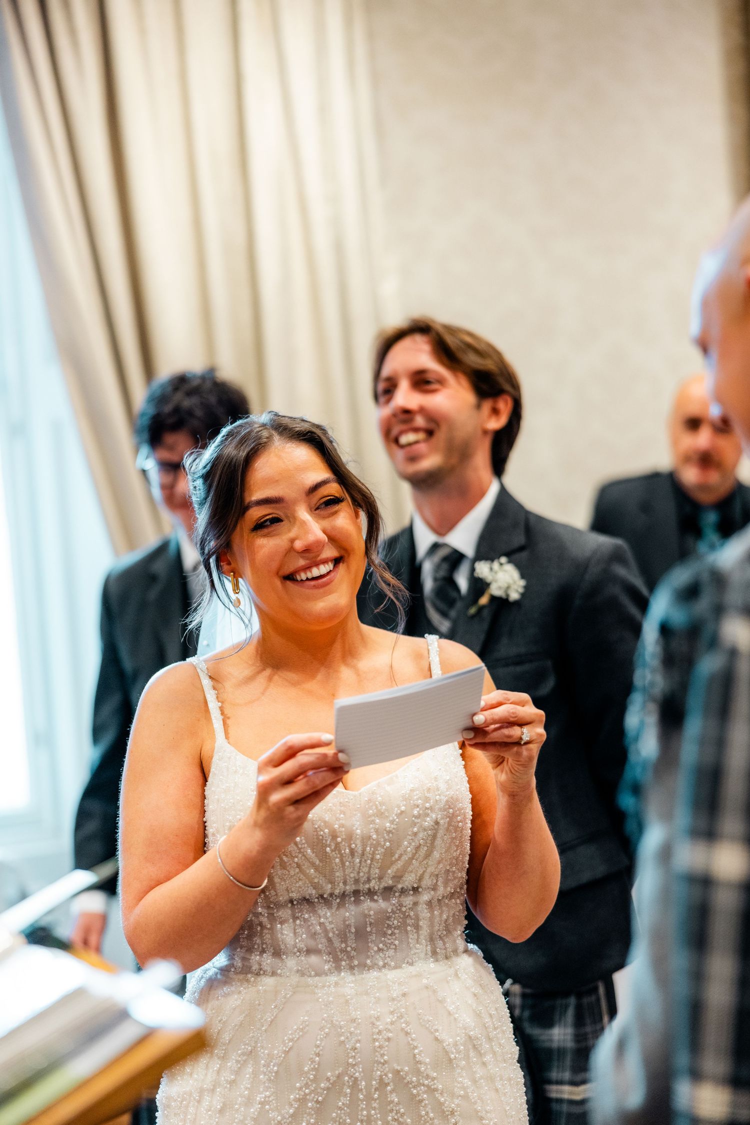 Bride reading vows, City Chambers wedding in Edinburgh, Scotland,