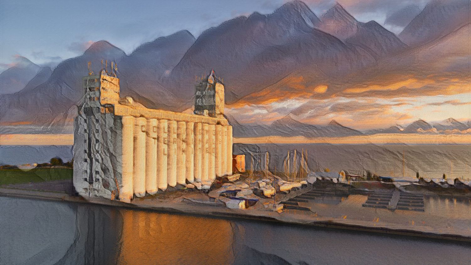 Dramatic painting of grain elevators near a waterway with mountains and vibrant sunset sky in background.