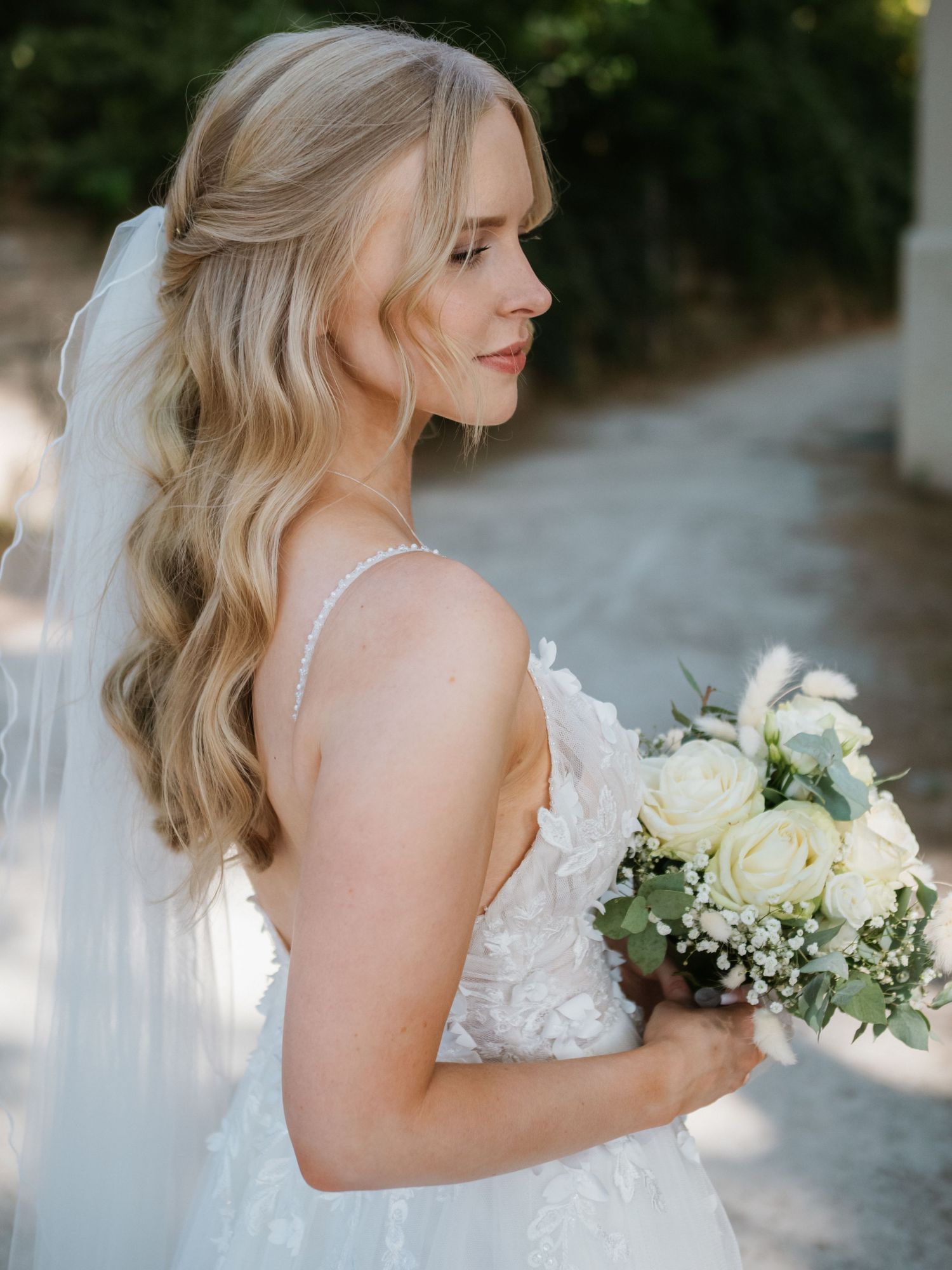 Elegant bridal portraits featuring white bouquet and lace wedding dress details.