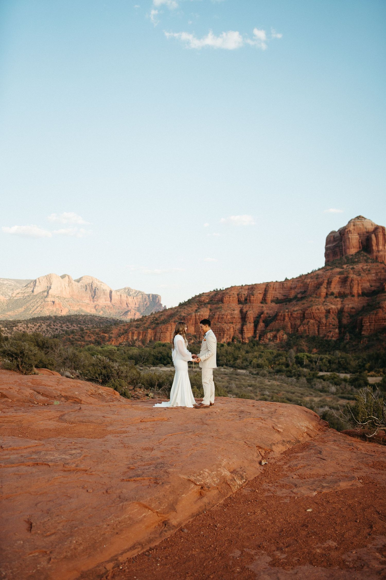 Desert wedding portrait with towering red rock formations in Sedona.