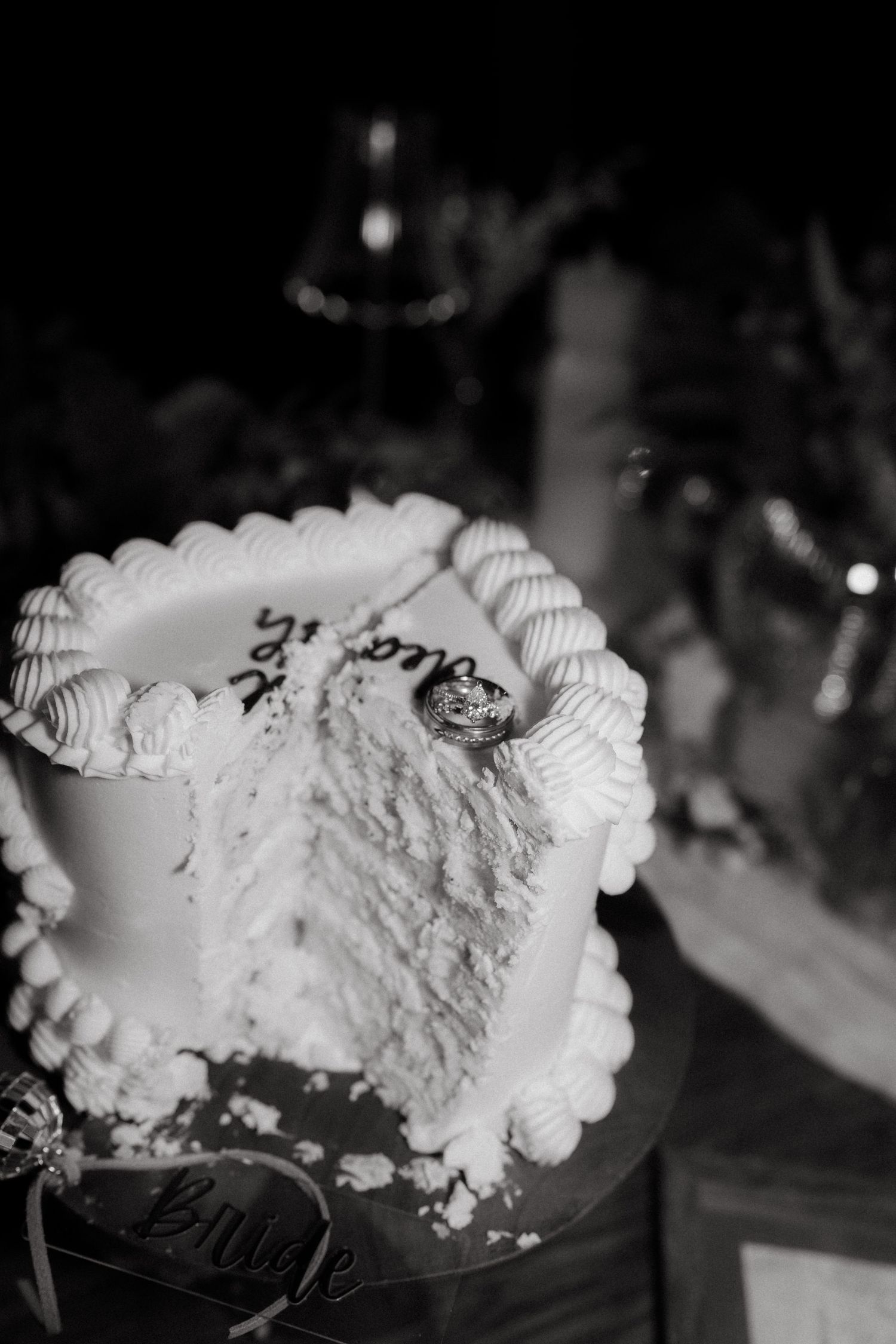 A black and white photo sequence showing a dessert plate with whipped cream being served in a restaurant setting.