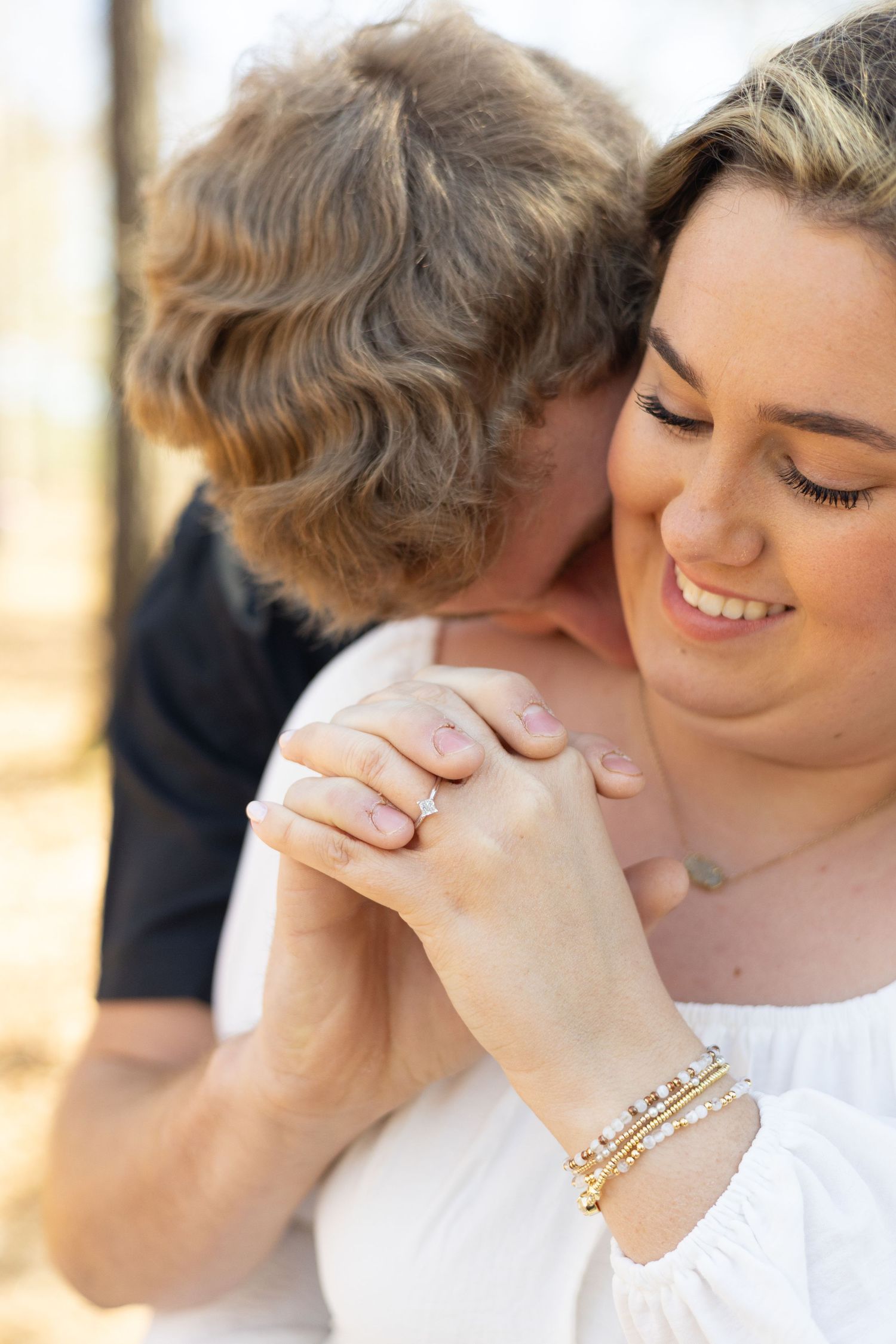 A series of tender moments captured in five similar close-up photographs showing affectionate interaction in soft lighting.