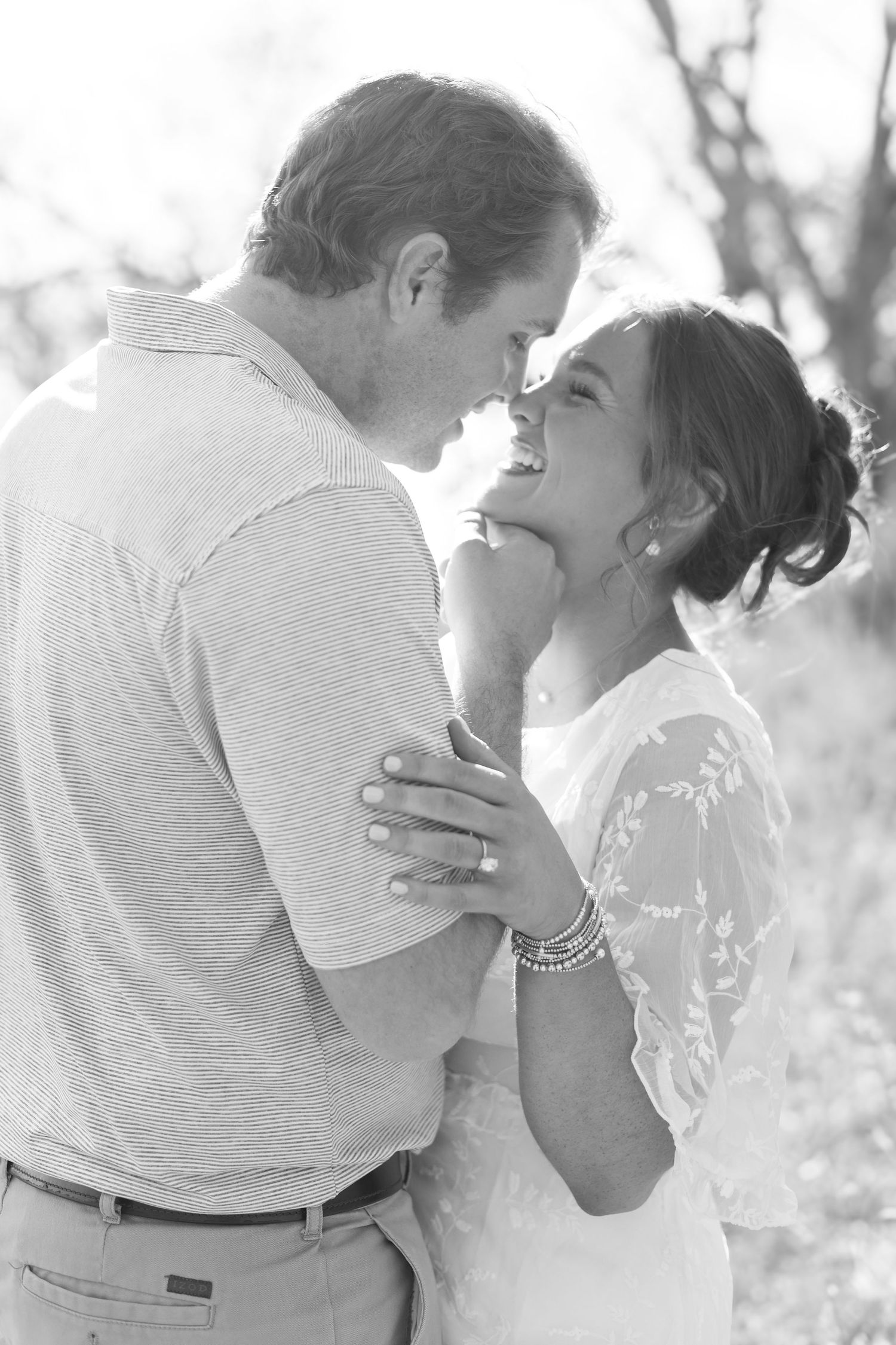 A romantic black and white photo series showing couples embracing in an intimate moment.