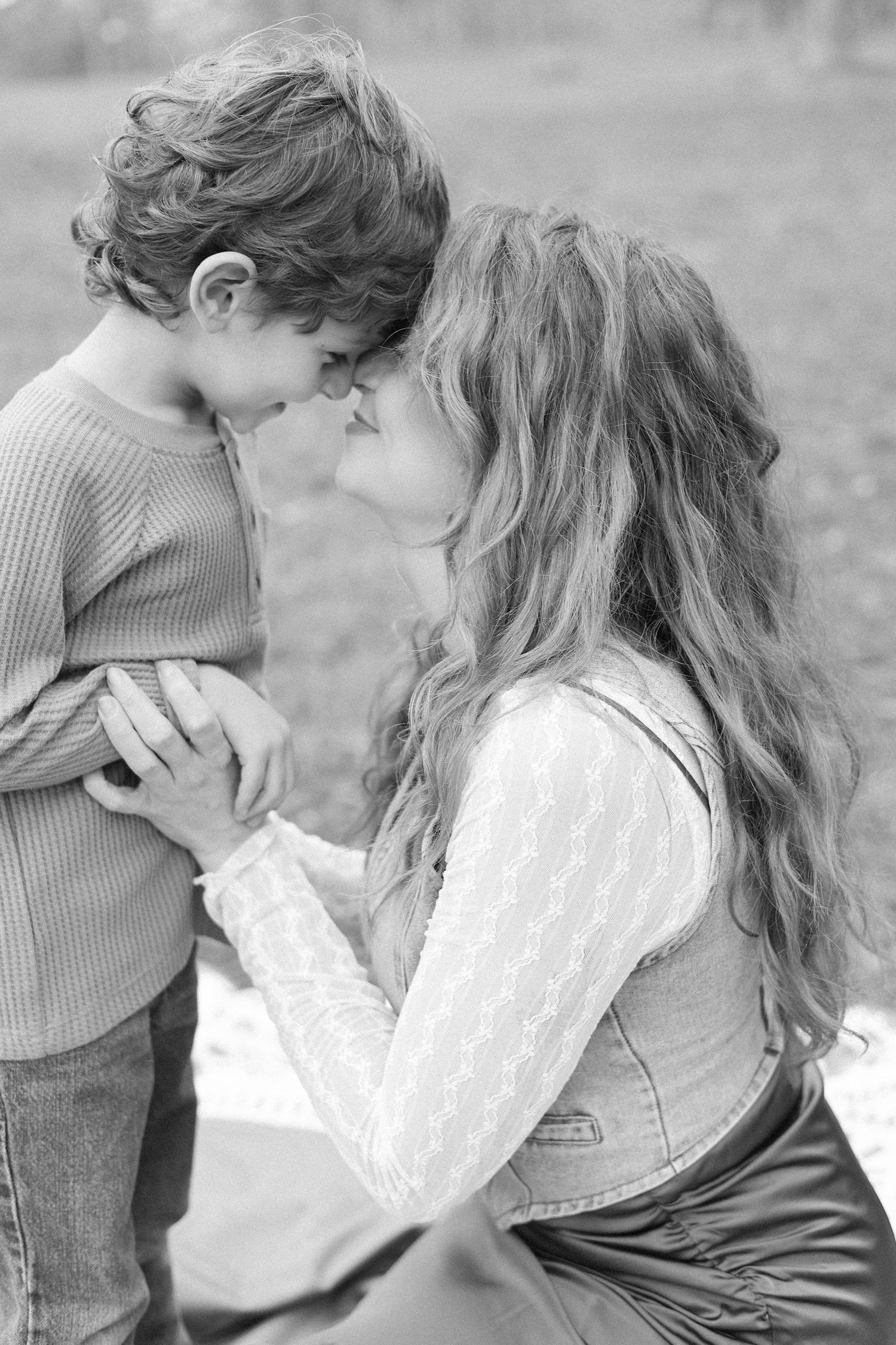 A black and white photo sequence showing a romantic embrace between two people wearing casual clothing.