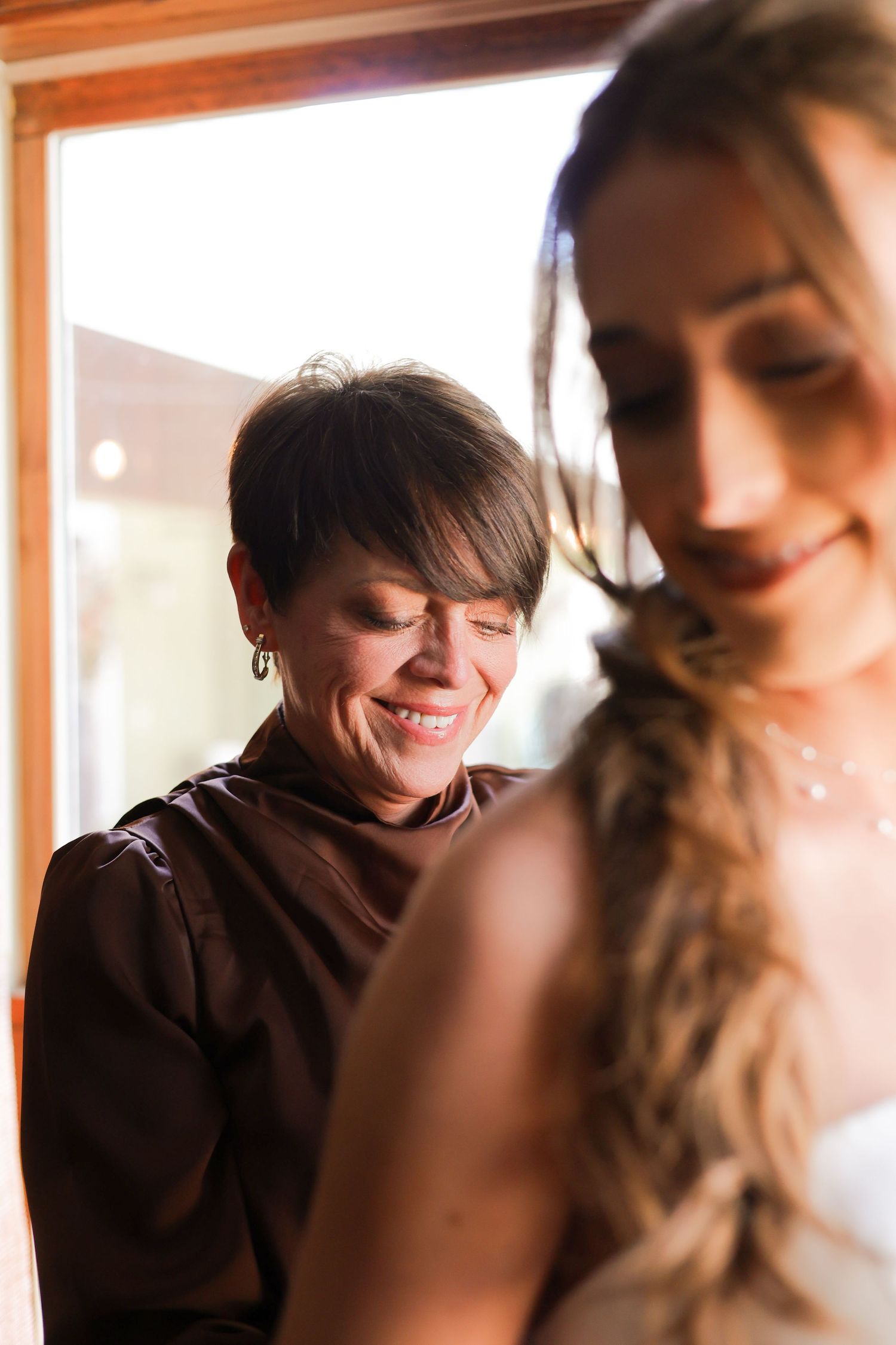 Intimate indoor portrait showing warm lighting and soft expressions.