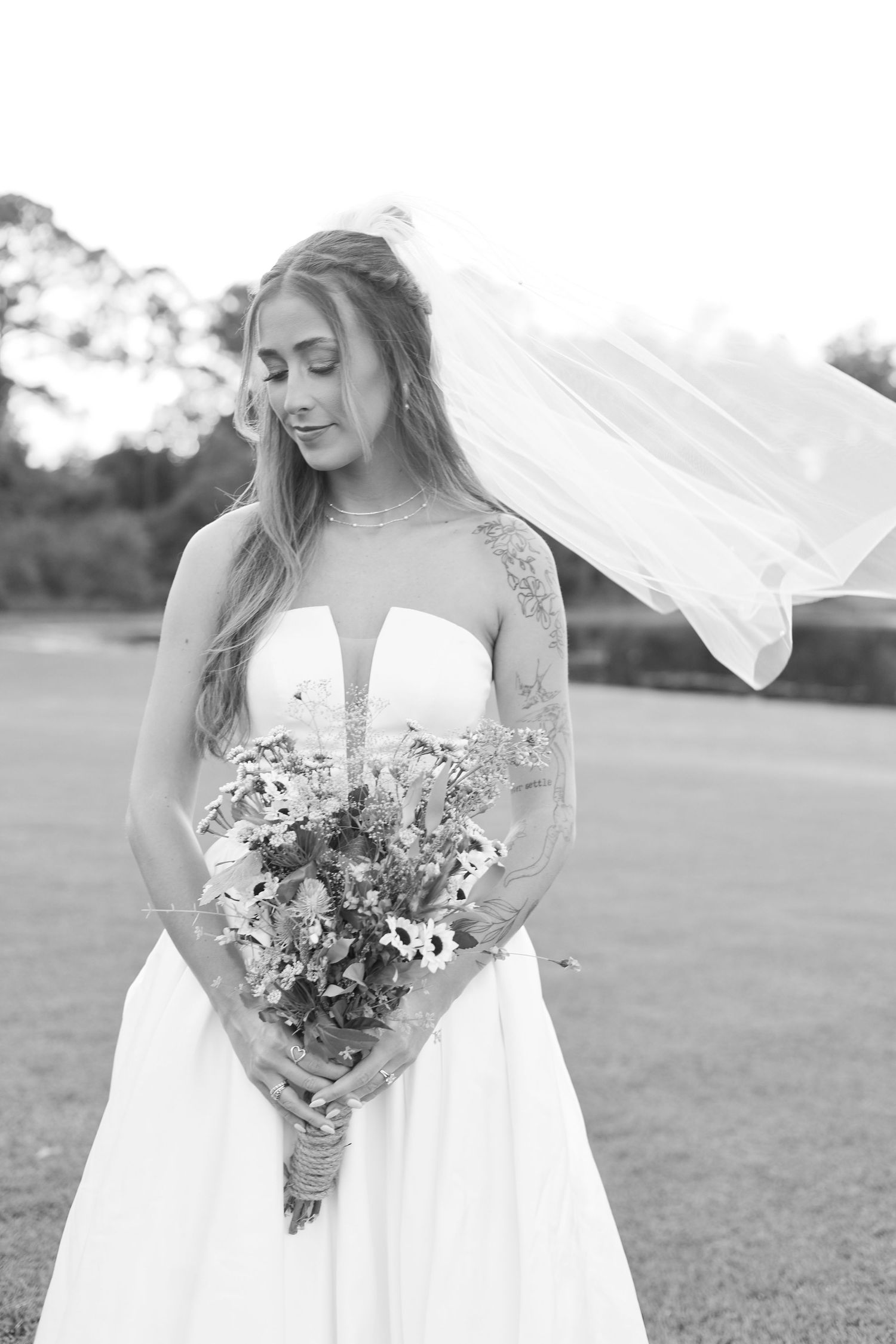 Black and white series showing bride with bouquet in different poses outdoors.