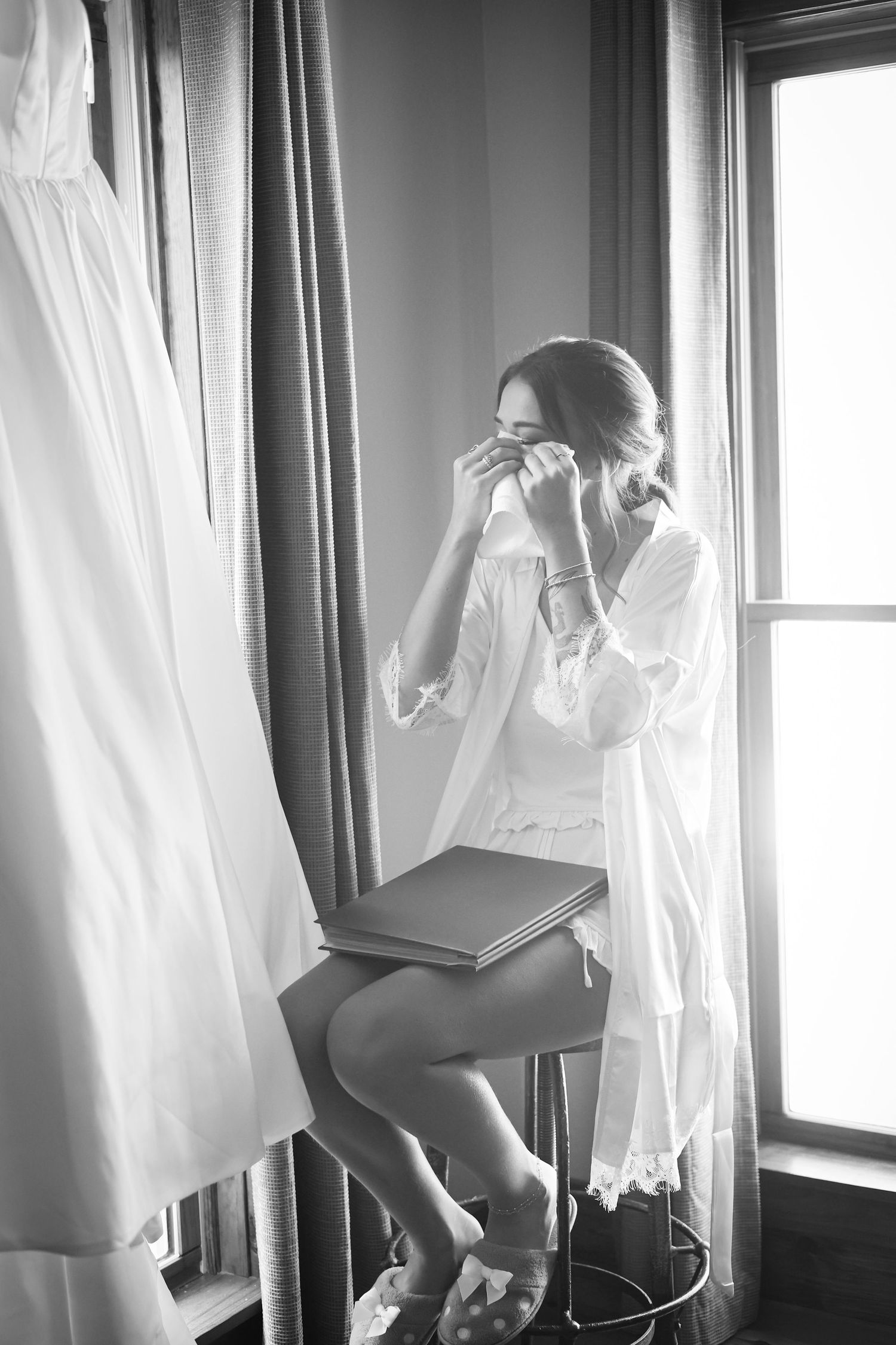 Artistic black and white photo of morning wedding preparations.