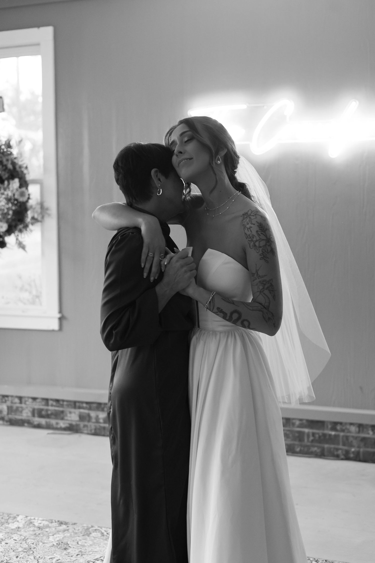 A series of intimate black and white photos showing tender moments during a wedding ceremony.