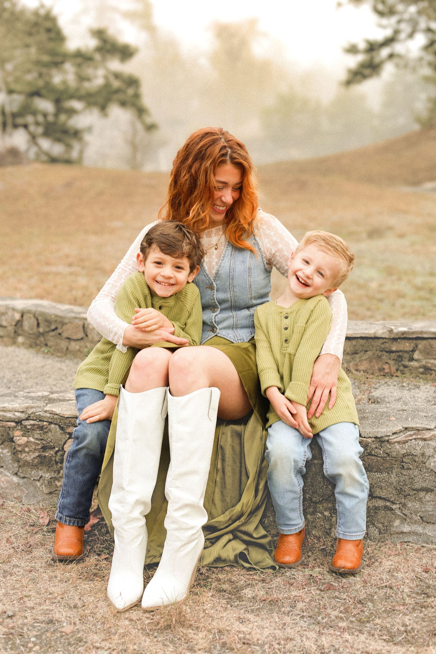 A candid outdoor photo sequence showing a playful moment between family members sitting on rocks in casual clothing.
