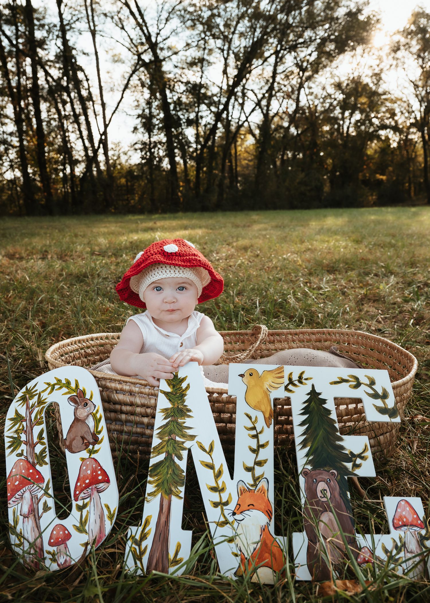 Woodland themed nursery decor with mushroom and forest animal cutouts.
