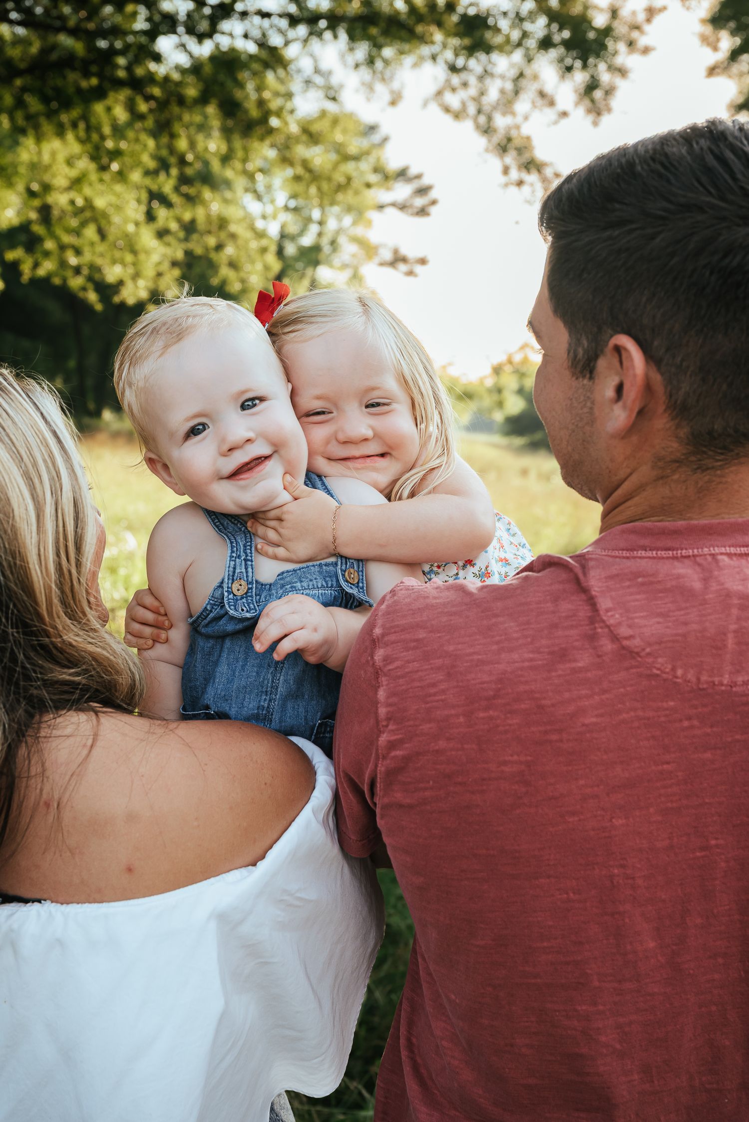 Close-up candid family moments captured during sunset in an outdoor setting.