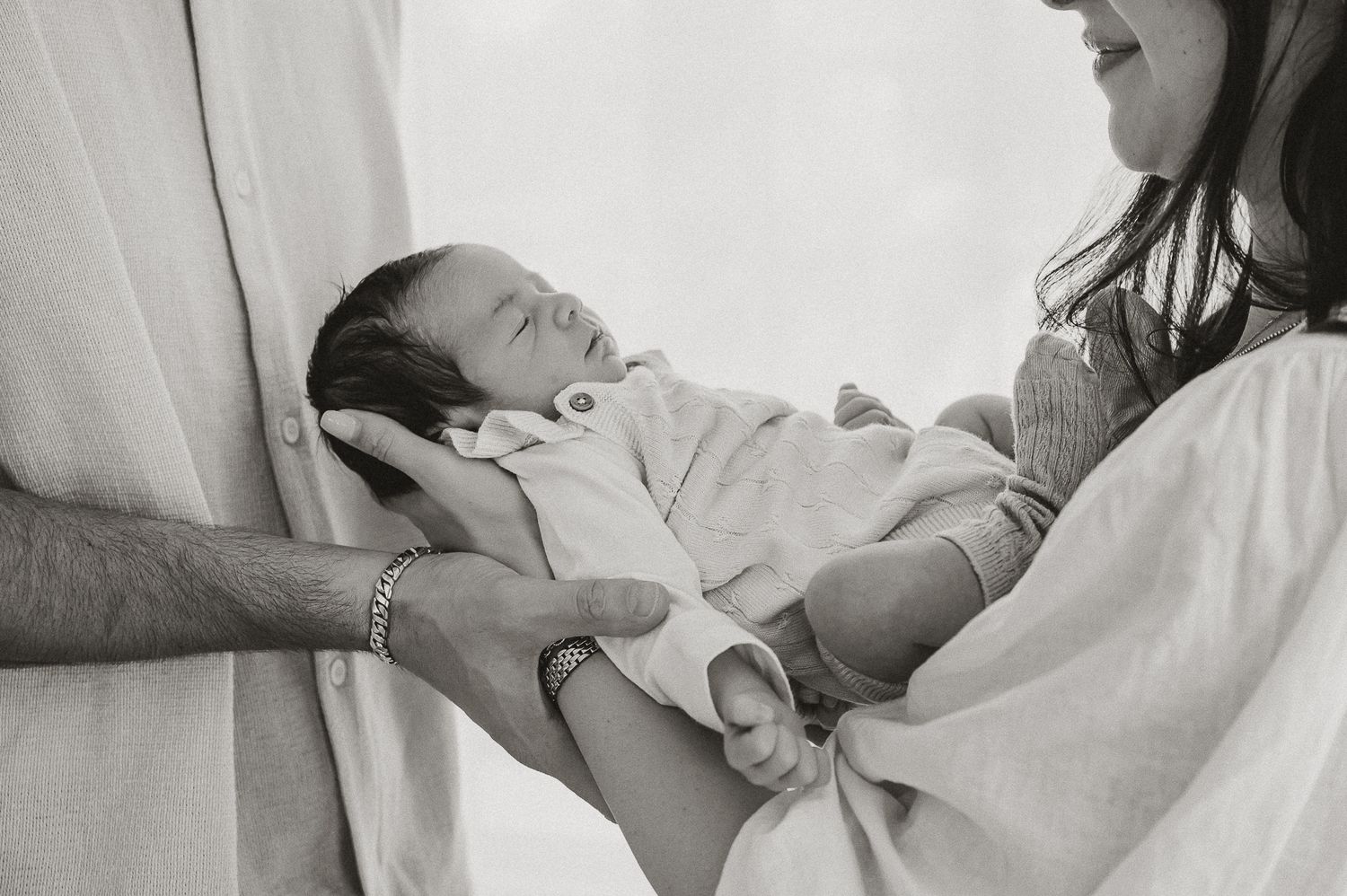Black and white close-up photos of a newborn baby's features.