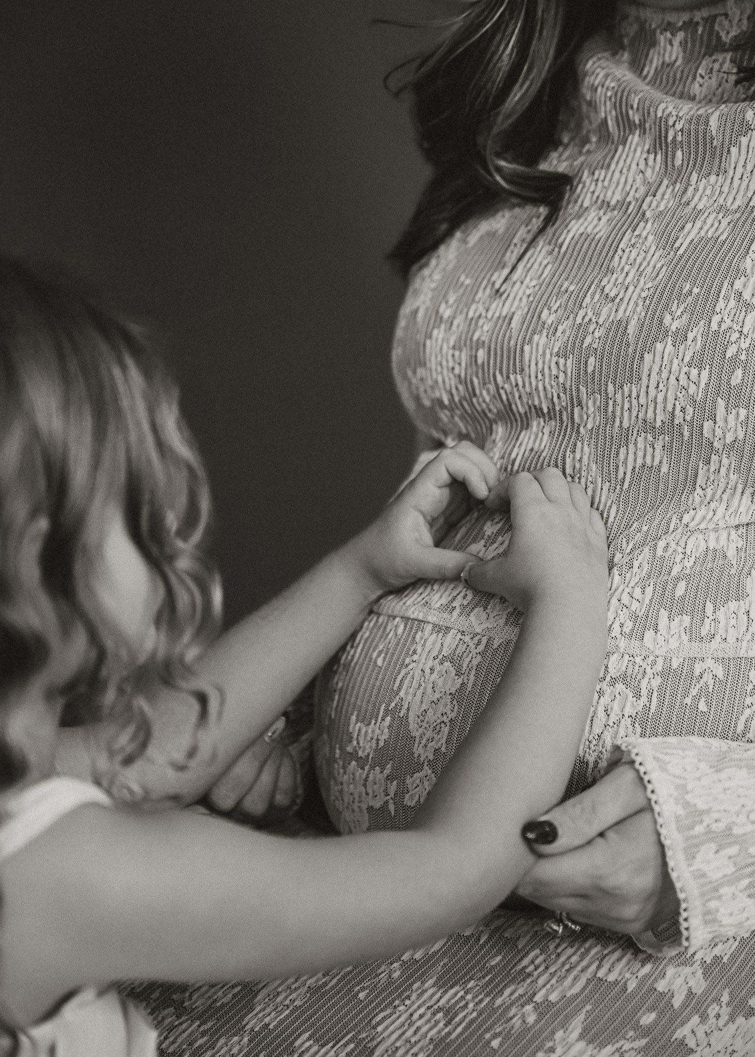 Intimate black and white photo series of a baby nursing.