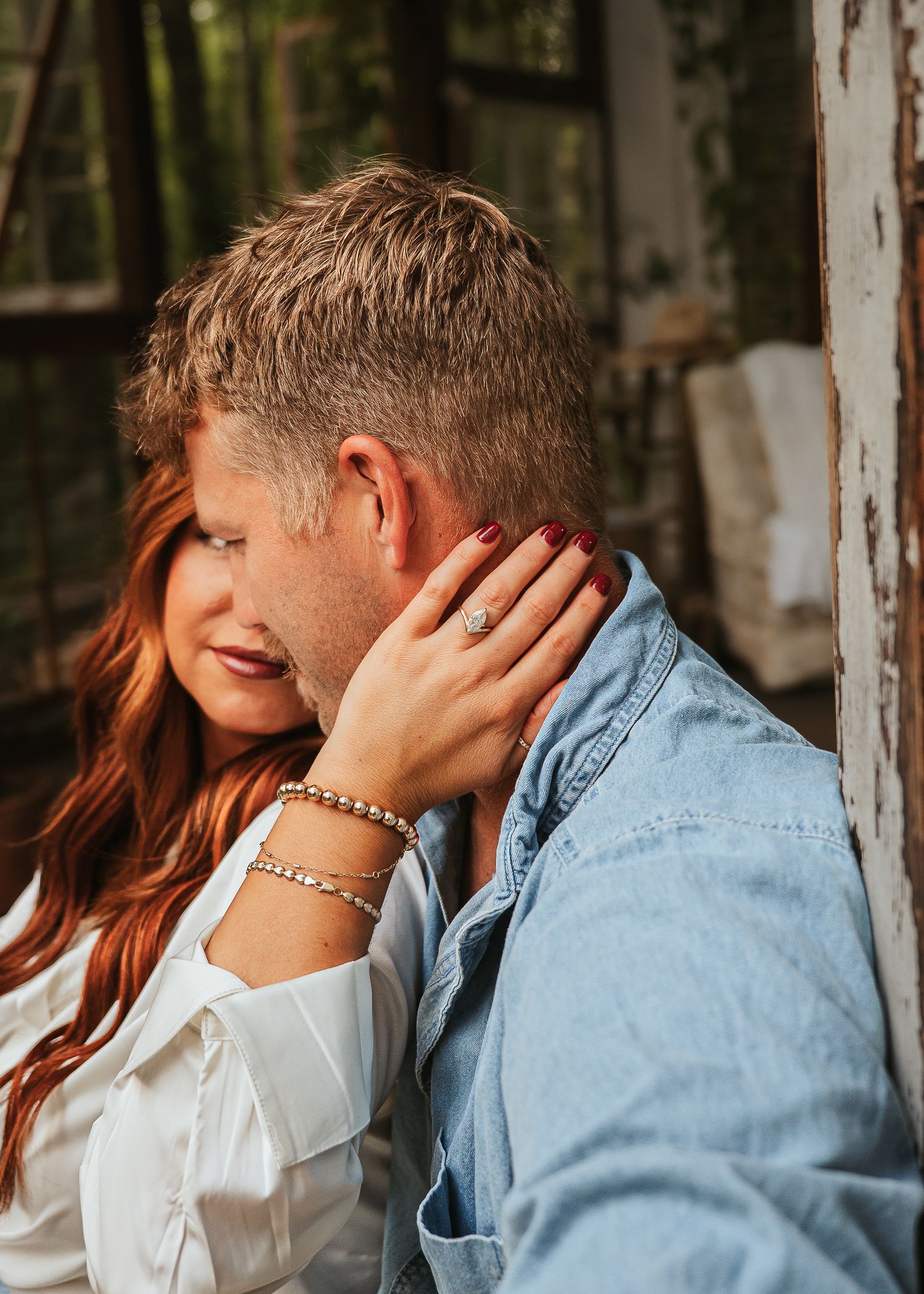 Intimate portrait series against white rustic wall showing tender moments.