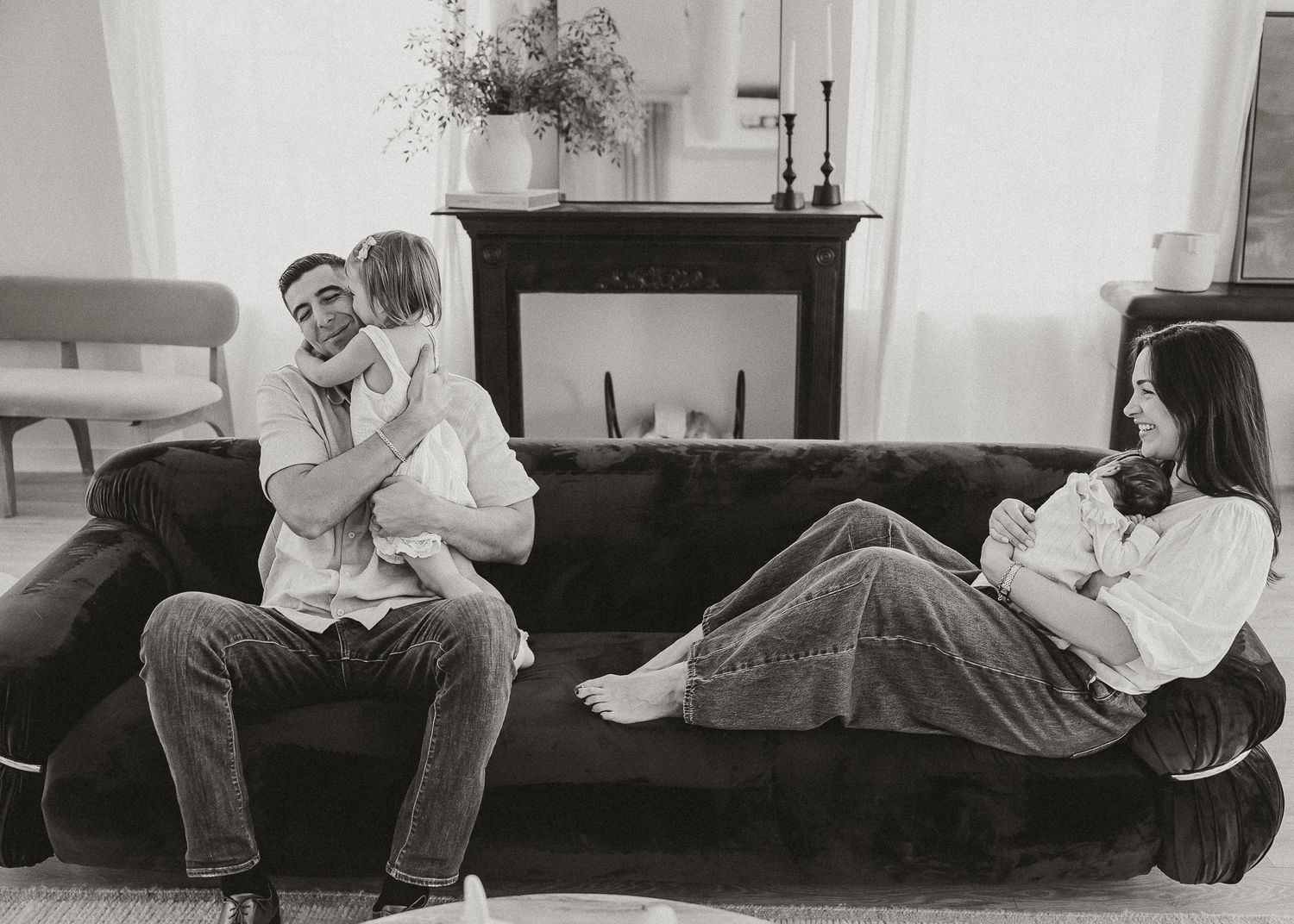 Black and white photo series showing a couple lying together on a couch in tender embrace.