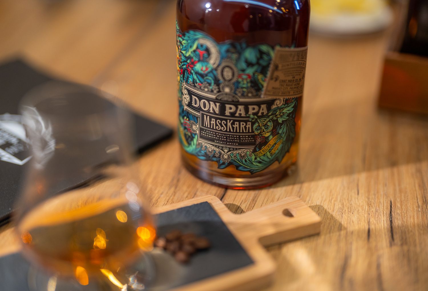 Artisanal beer bottles displayed on a wooden surface with dark labels.