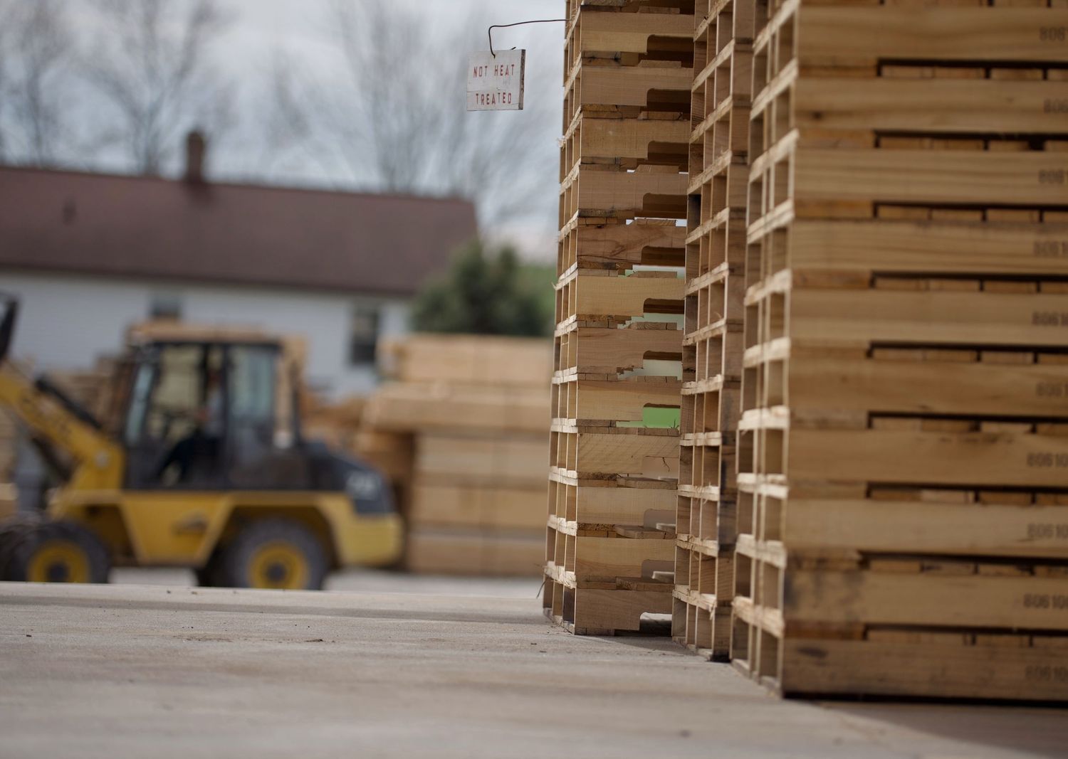 Wooden pallets and a loader