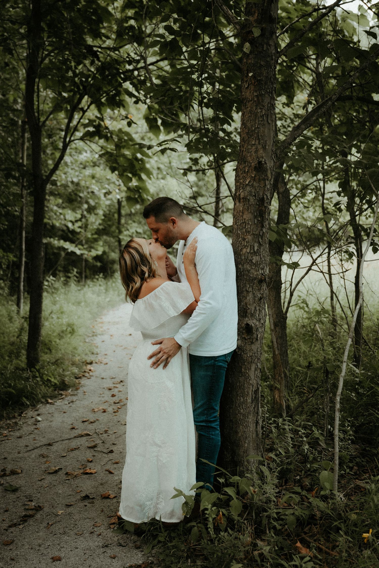 A romantic photoshoot  captures intimate moments between two people in white and casual attire. Pittsburgh Wedding Photographer