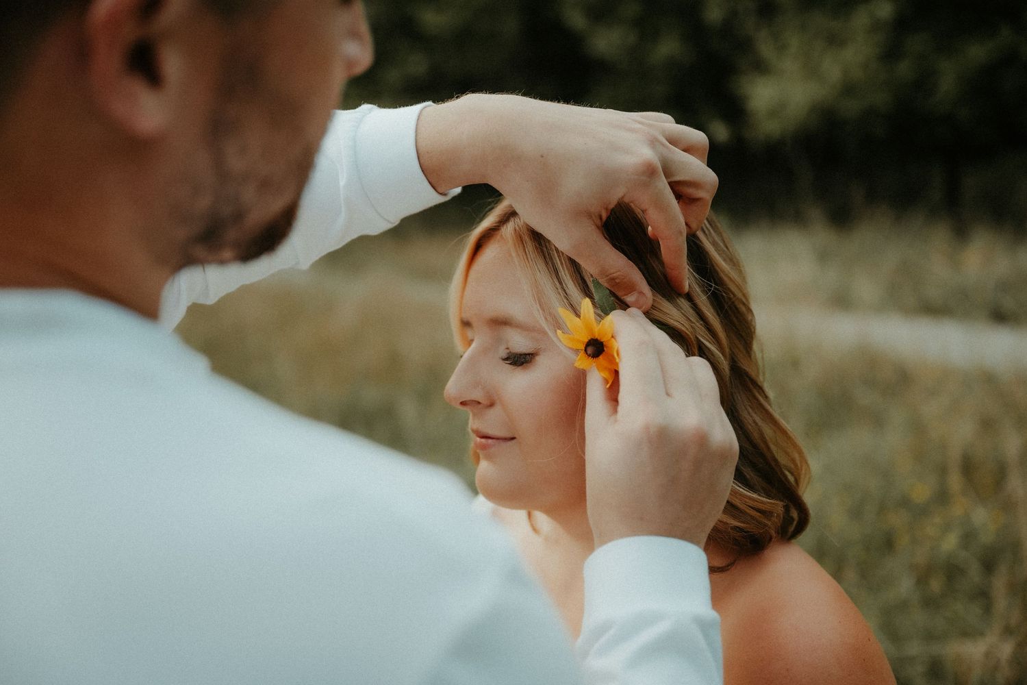 Gentle, intimate moment between couple during outdoor wedding ceremony at sunset with soft golden lighting. Pittsburgh Wedding Photographer