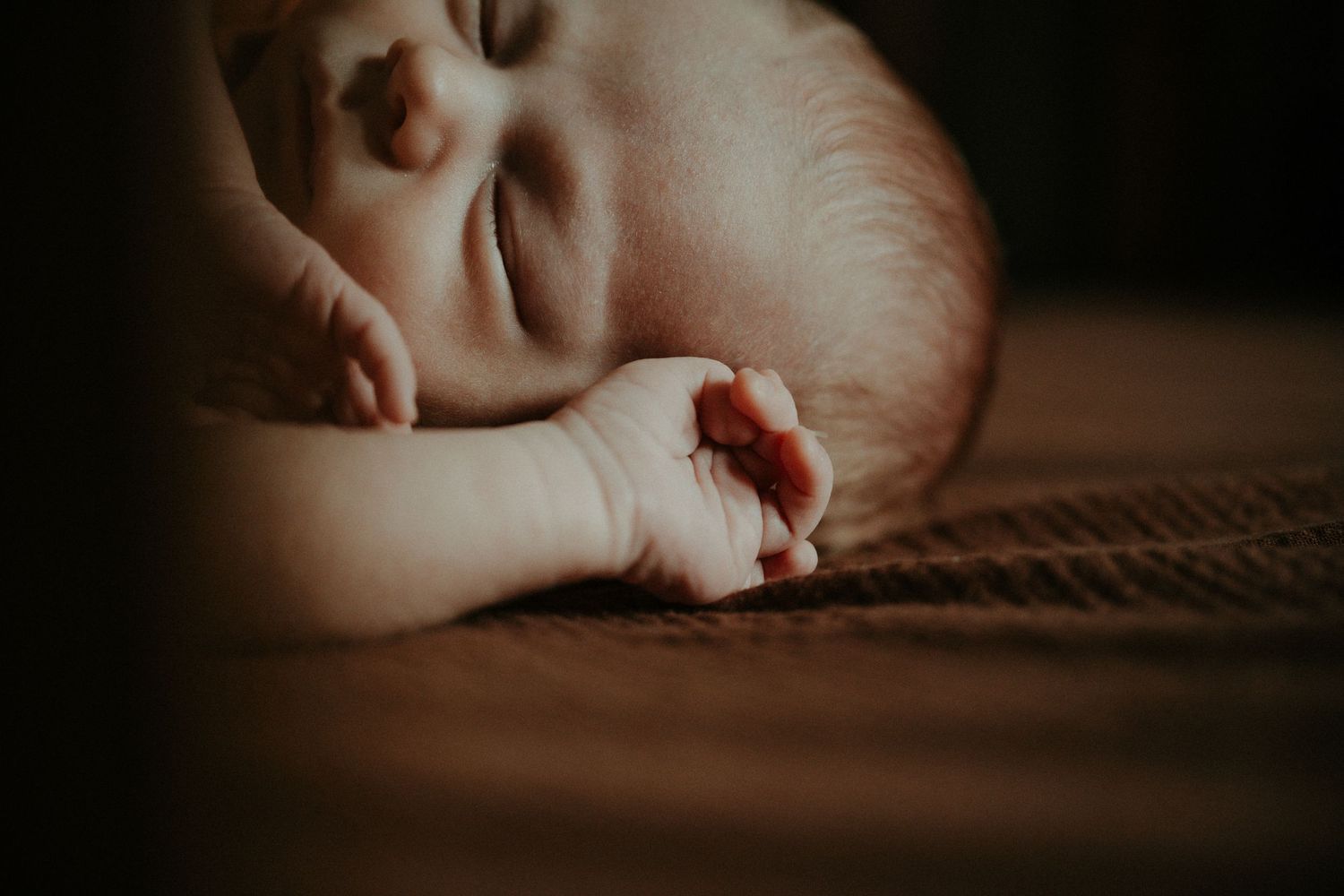 Extreme close-up macro shots show smooth skin and soft textures in warm sepia tones. Pittsburgh / Westmoreland Photographer