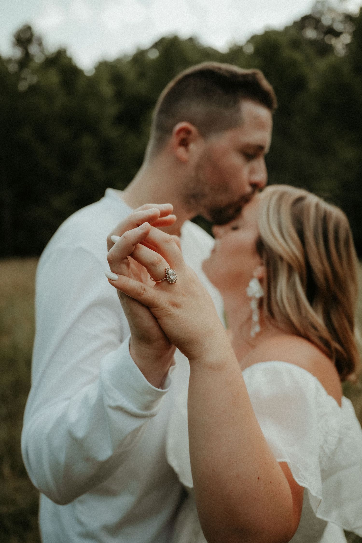 A tender moment captured between a couple as they embrace during an outdoor photoshoot. Pittsburgh Wedding Photographer