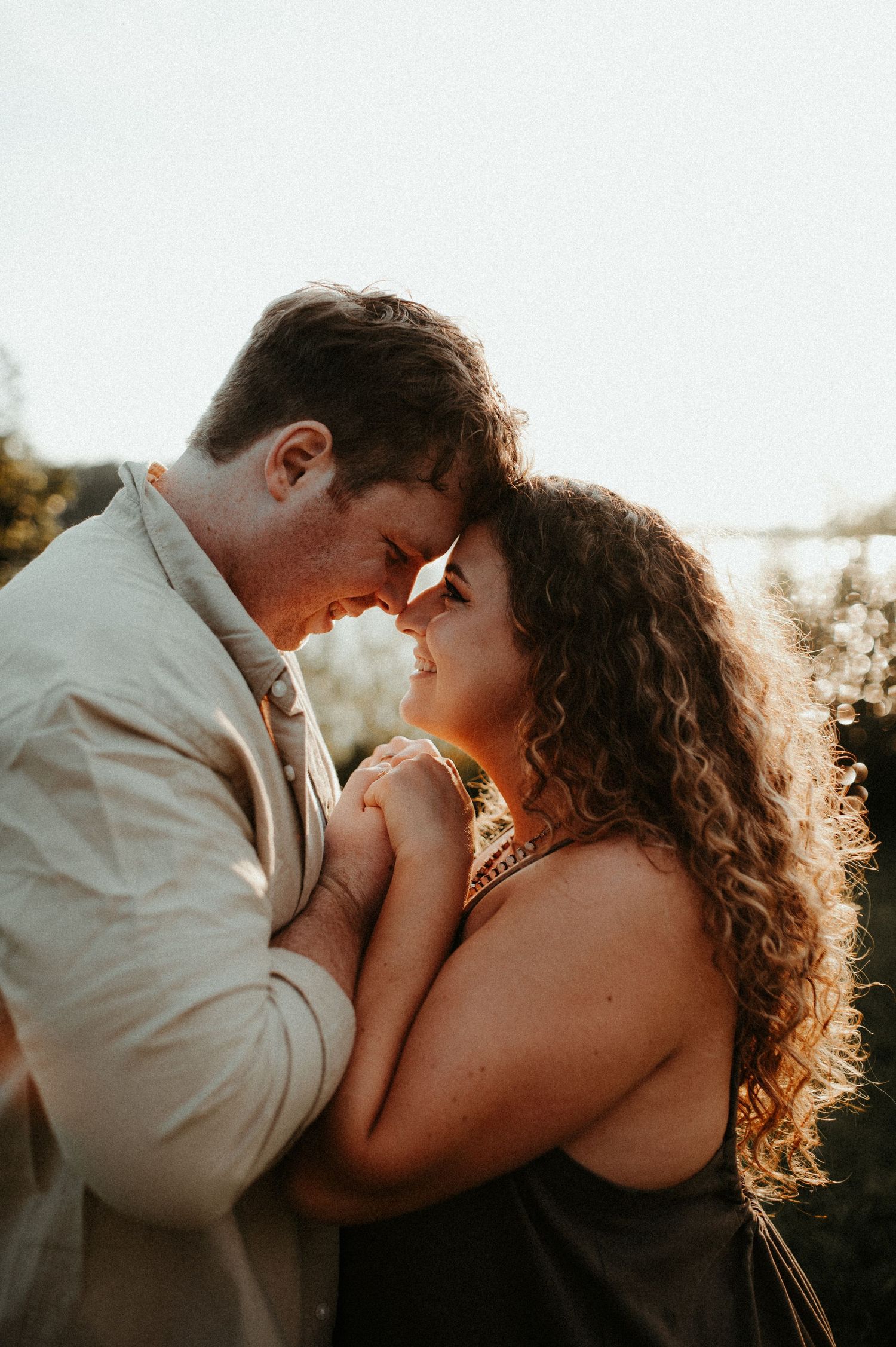 Romantic sunset portrait of couple sharing intimate moment outdoors. Pittsburgh Wedding Photographer