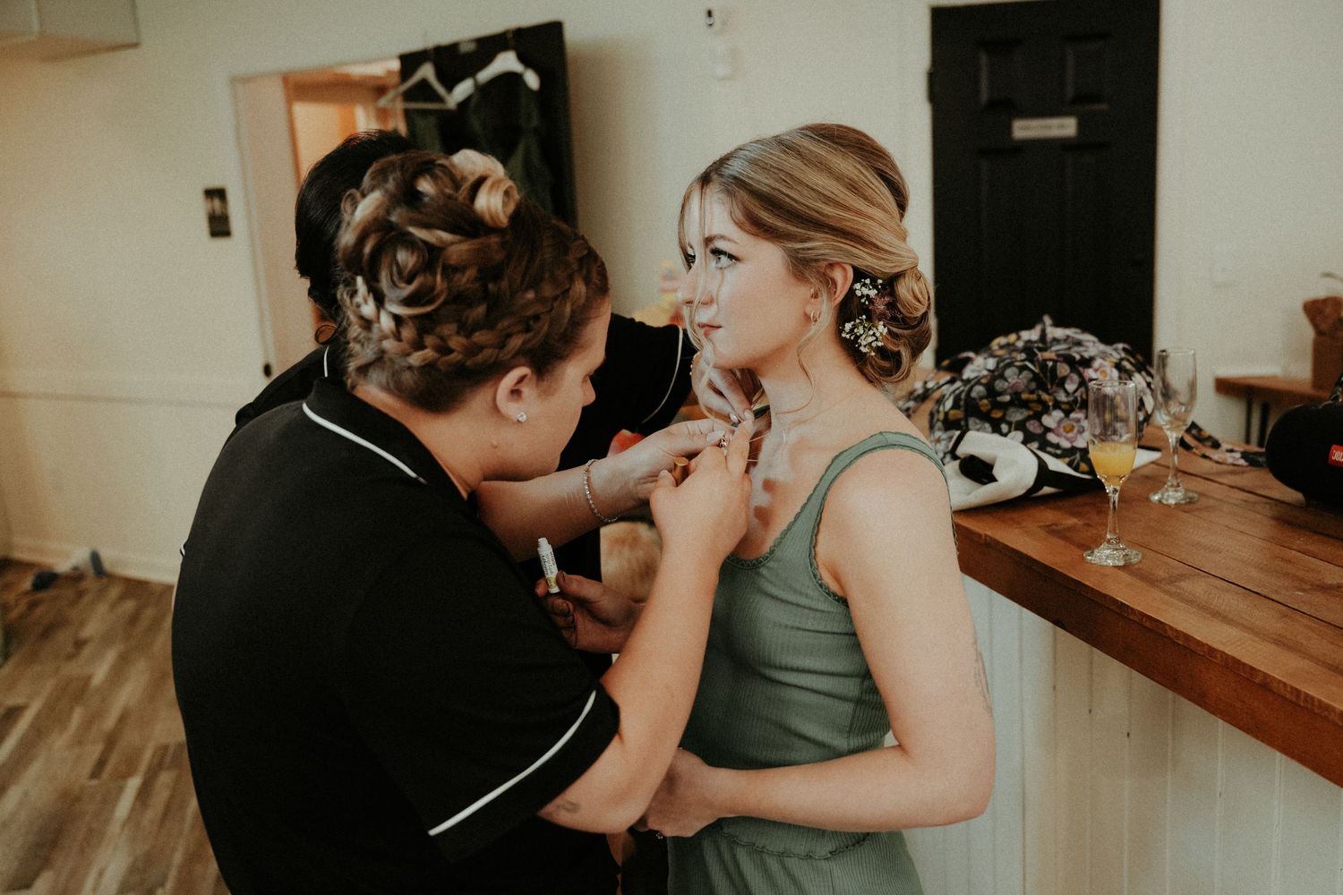 Wedding party candid photos showing people in candid moments during hair styling and preparation. Pittsburgh Wedding Photographer