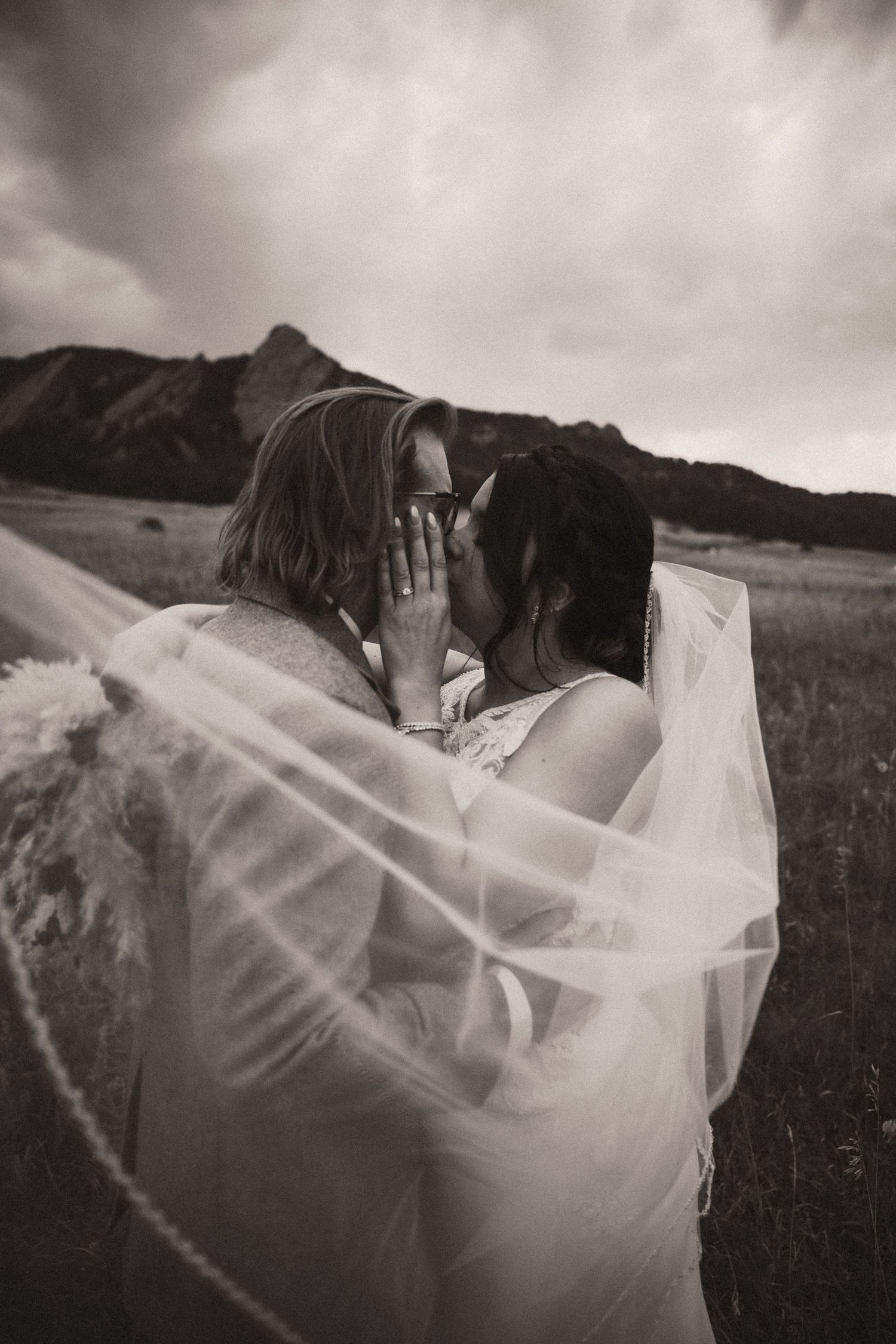 A romantic black and white sequence of a bridal veil flowing in the wind during an outdoor wedding photoshoot. Travel Elopement Photographer