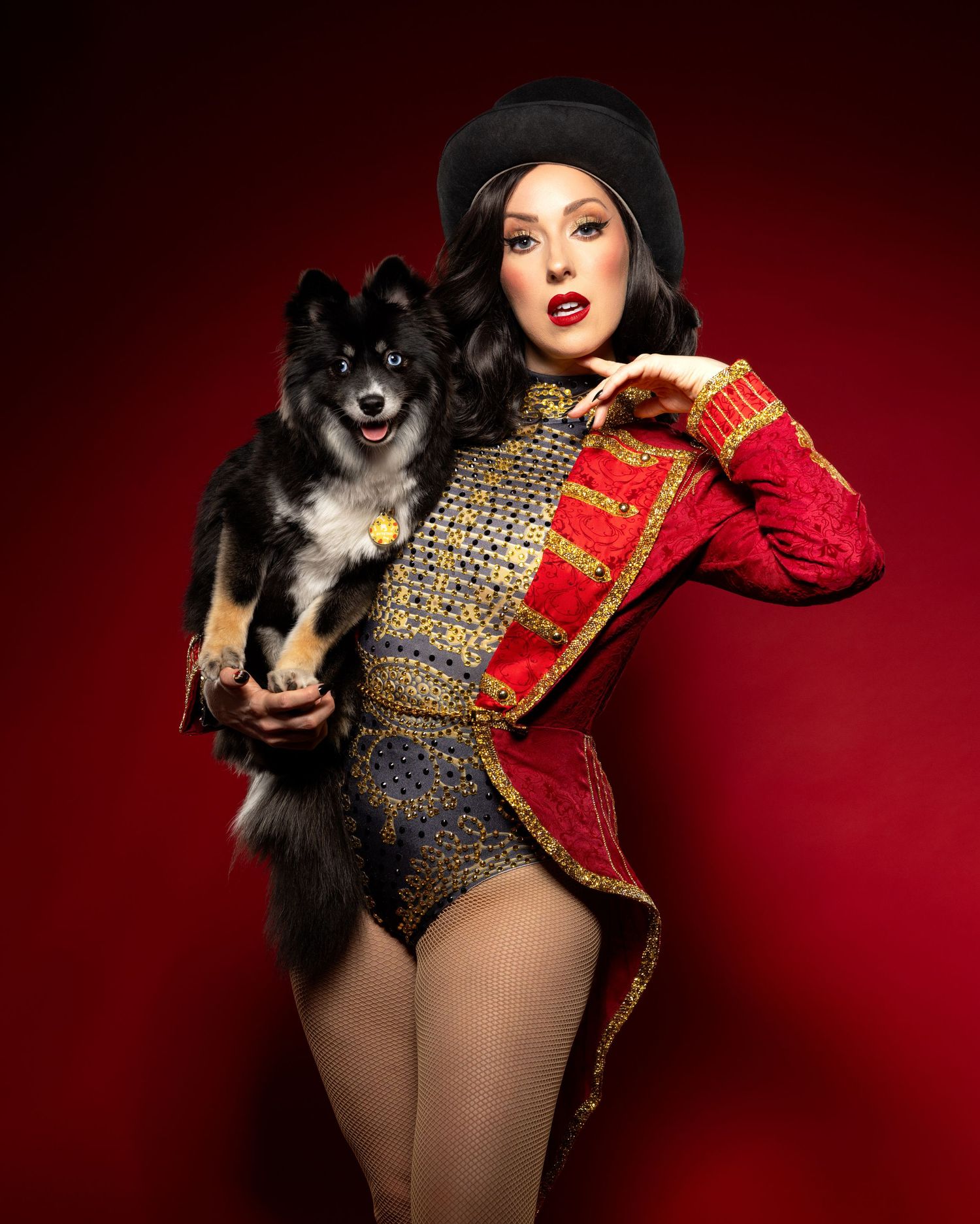 A glamorous burlesque-style photo series with a black dog against a deep red background.