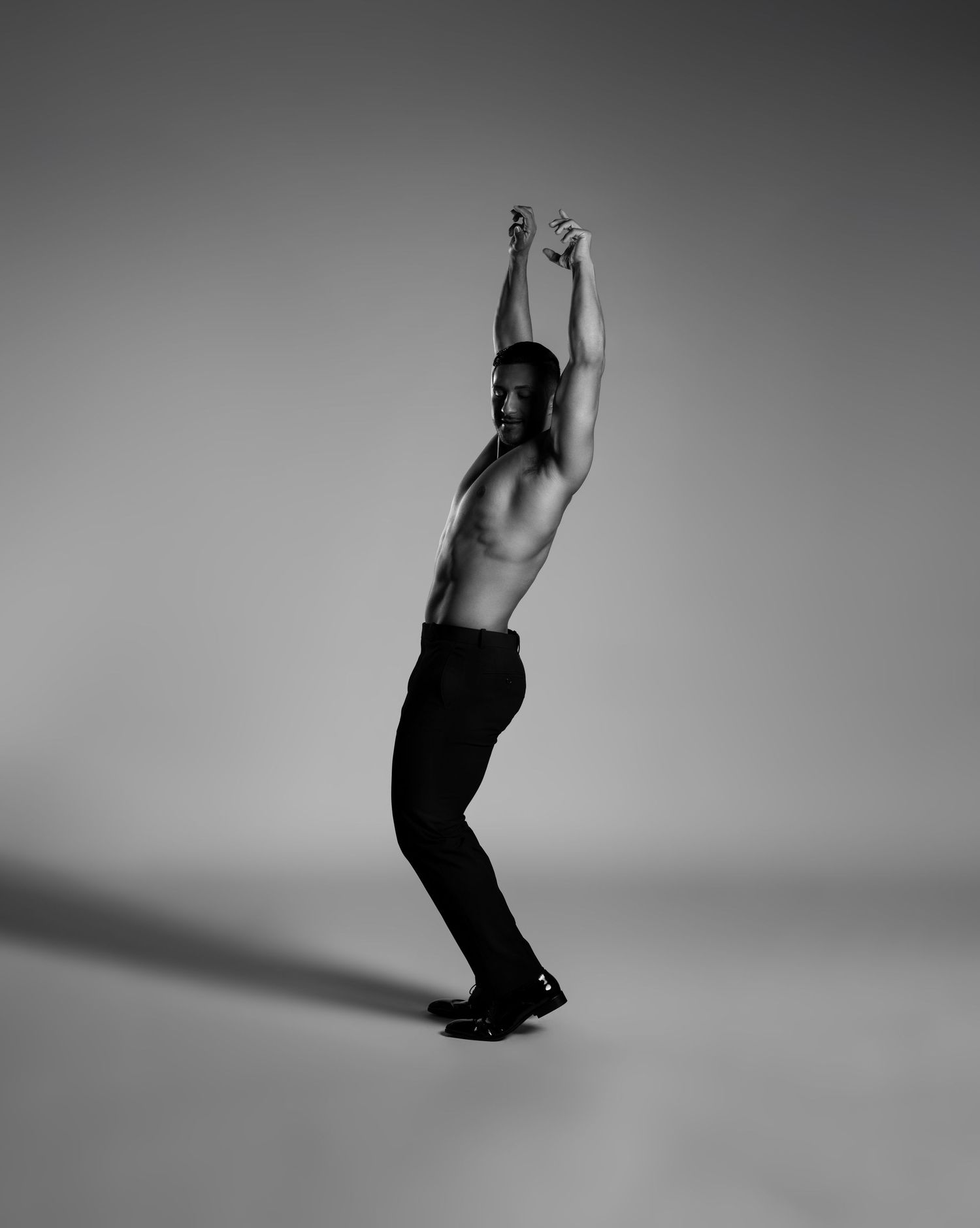 A series of black and white photos showing a person falling through space in a graceful sequence.