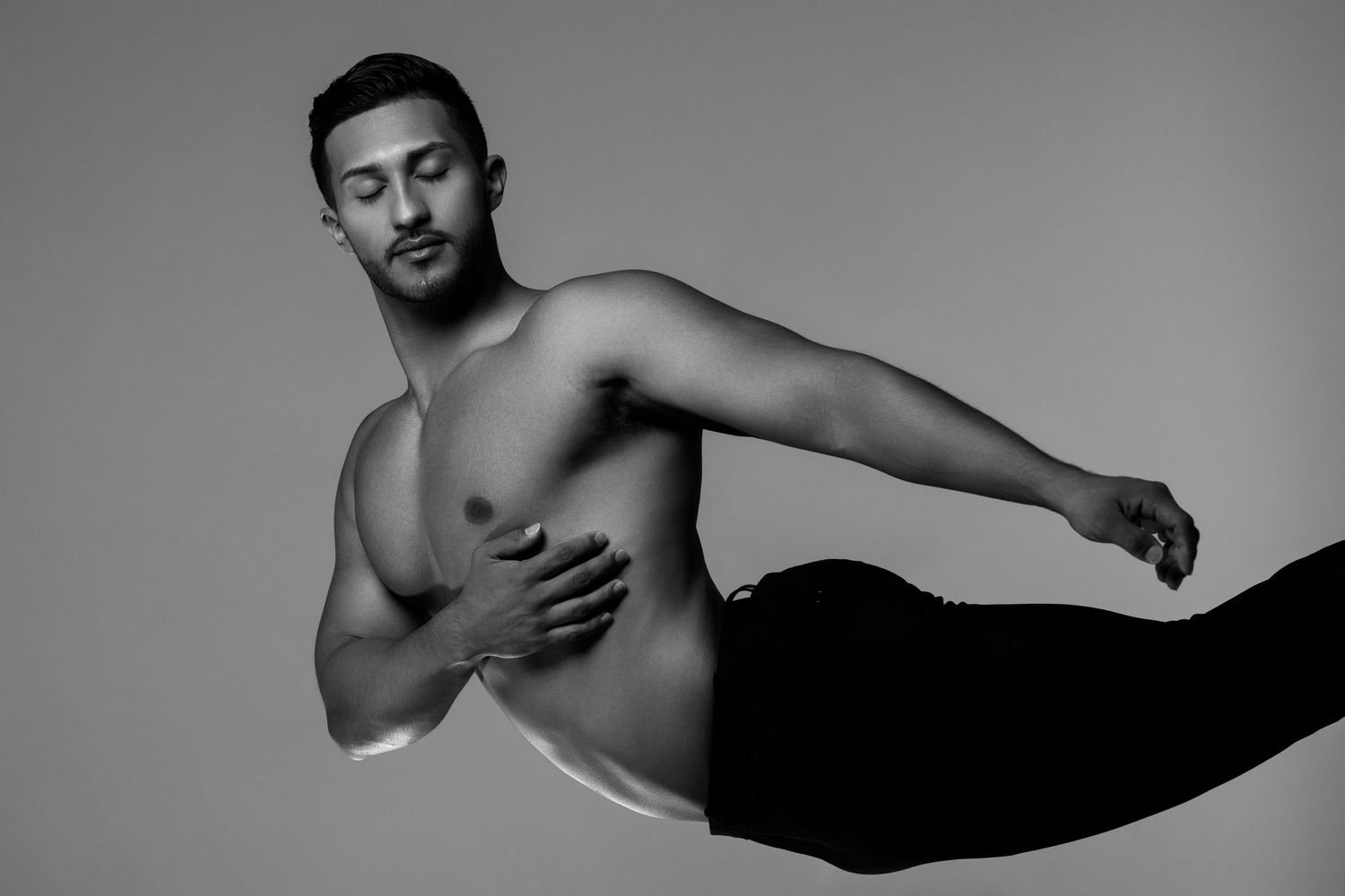 A series of black and white artistic dance photographs showing graceful movements and poses against dark backgrounds.