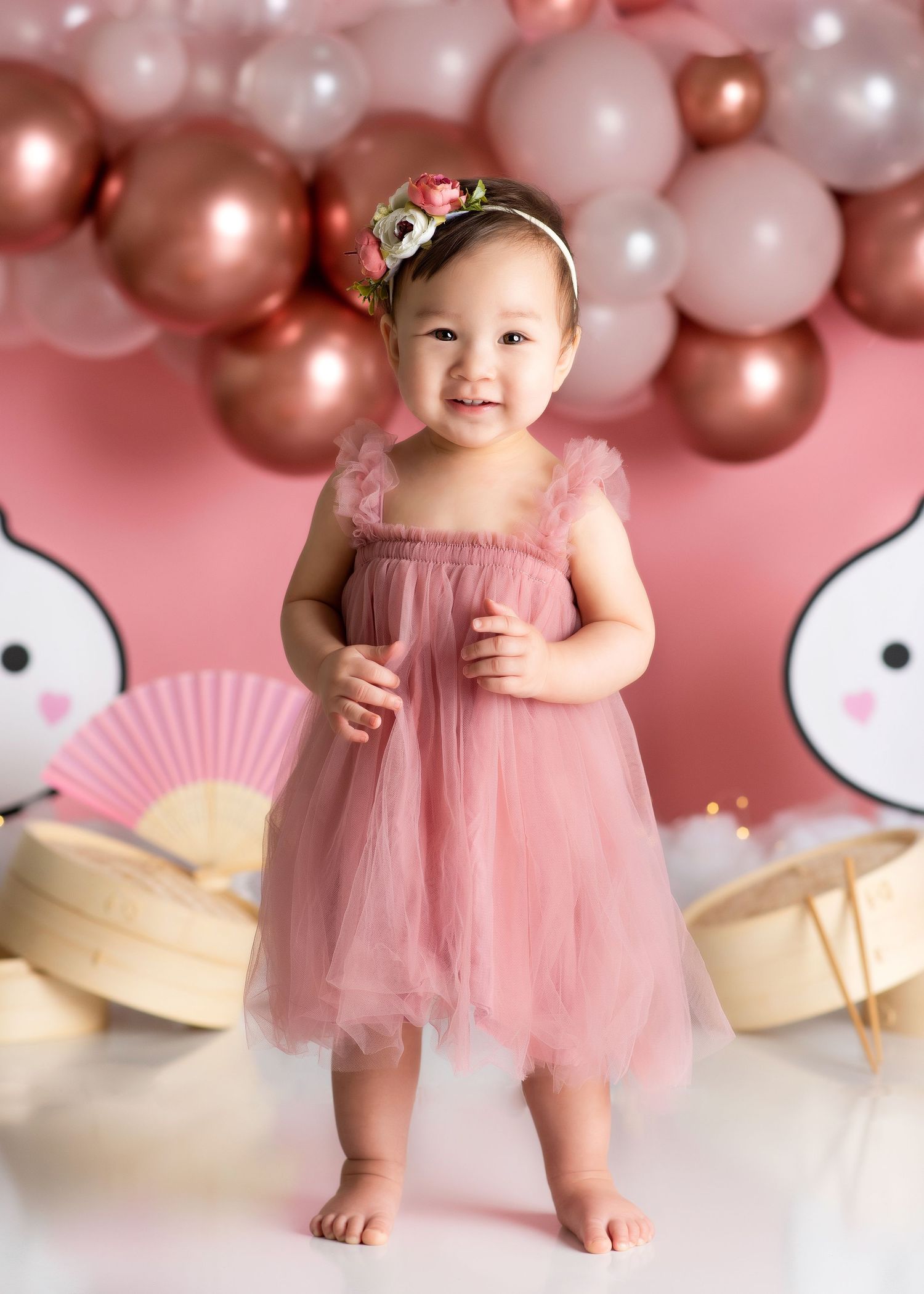 a young girl stands in a dumpling themed studio