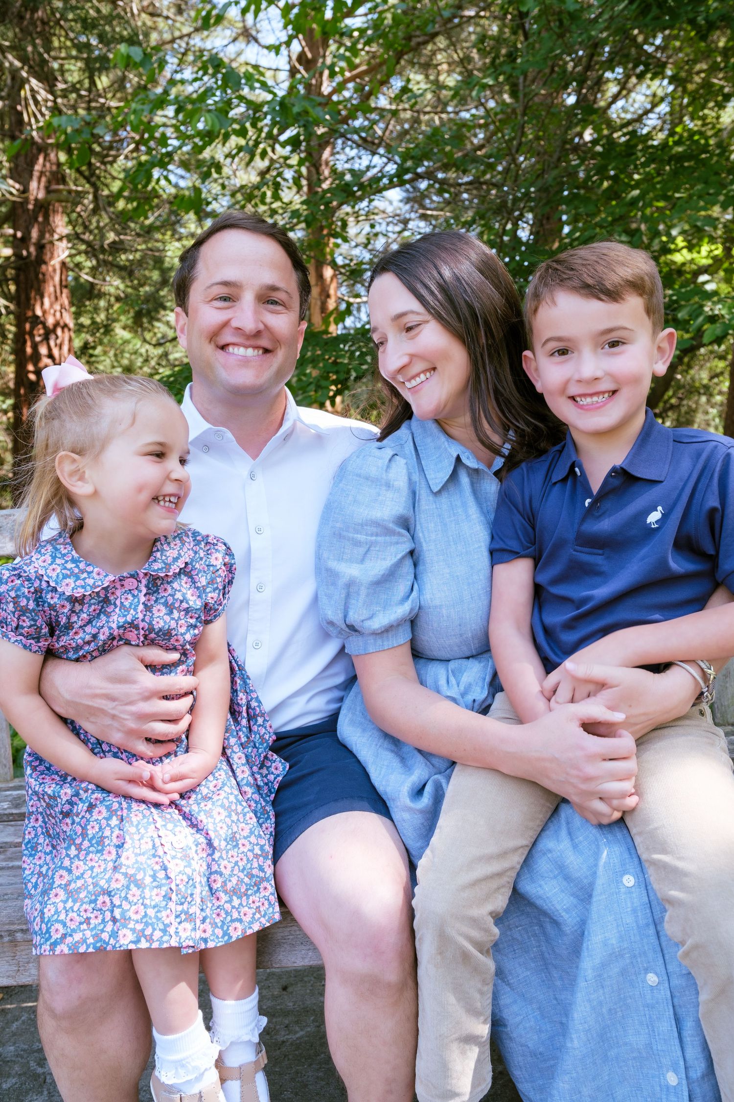A candid sequence of four family photos taken outdoors with natural greenery in the background.