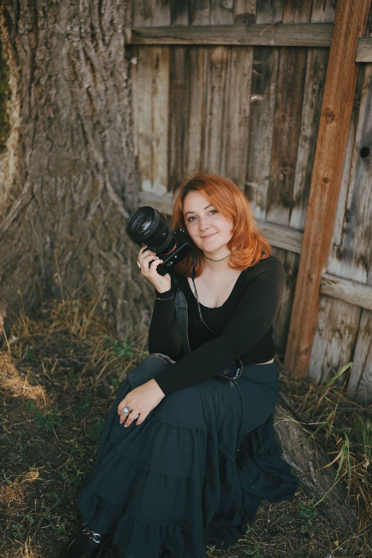 Natural light portrait featuring photographer with camera in outdoor setting. Jessicamh Productions