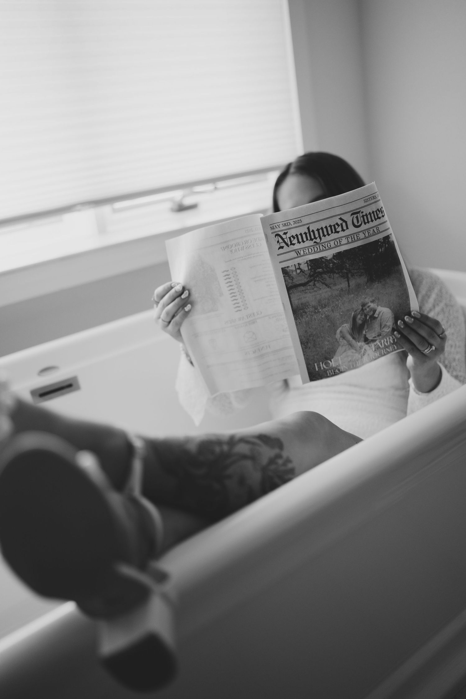 Black and white sequence of someone reading a newspaper while relaxing in bed.