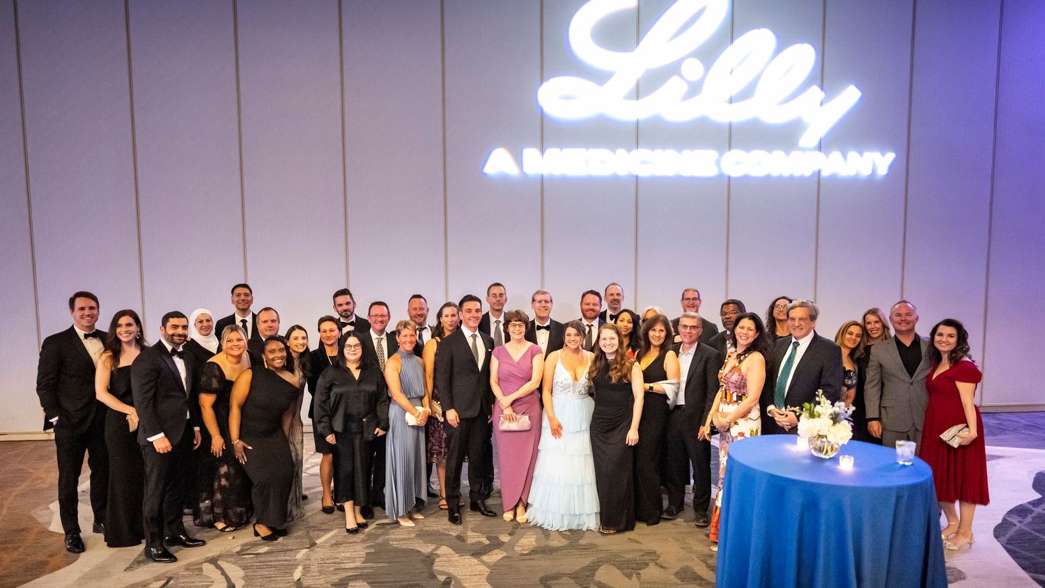 Large group of pharmaceutical professionals at a fundraiser event