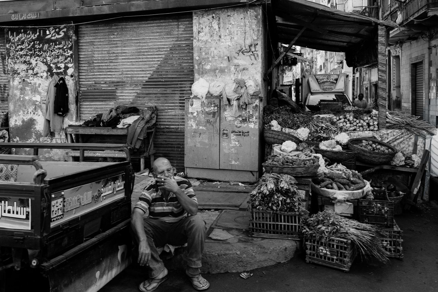 Rene Olivas Photography Tired Merchant Takes a Cigarette Break, Alexandria, Egypt