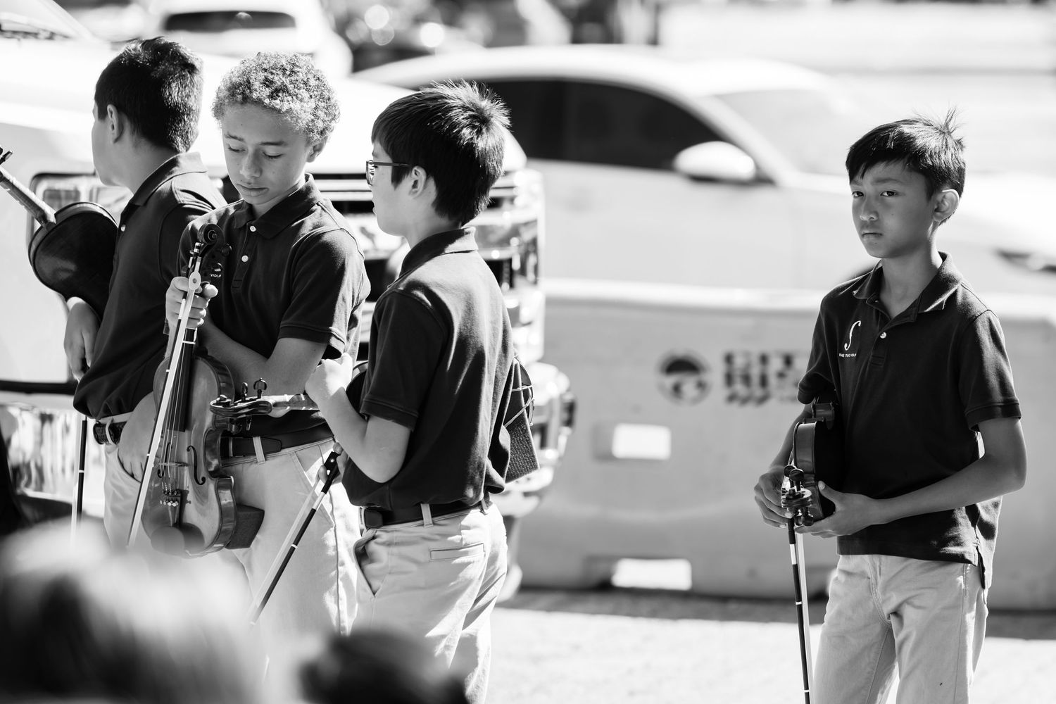 Young violinist taking a deep breath backstage before The Studio Violin's performance at the Lafayette Art & Wine Festival
