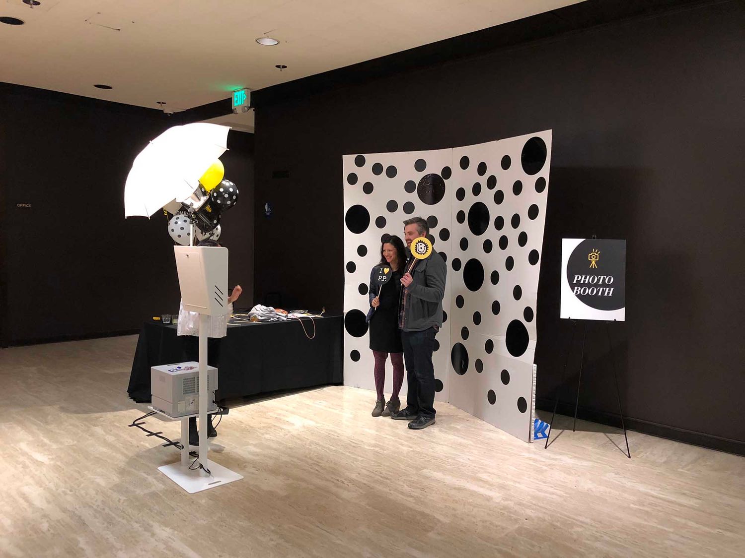 Notice that the light is at a steeper angle. This is due to the backdrop that the client provided for the event. The black circles are actually glossy vinyl stickers that ended up reflecting the flash when the strobe was positioned at a traditional 45 degree angle.
