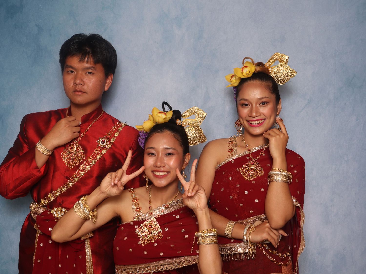 Traditional red and gold wedding attire at Newark Pavilion.