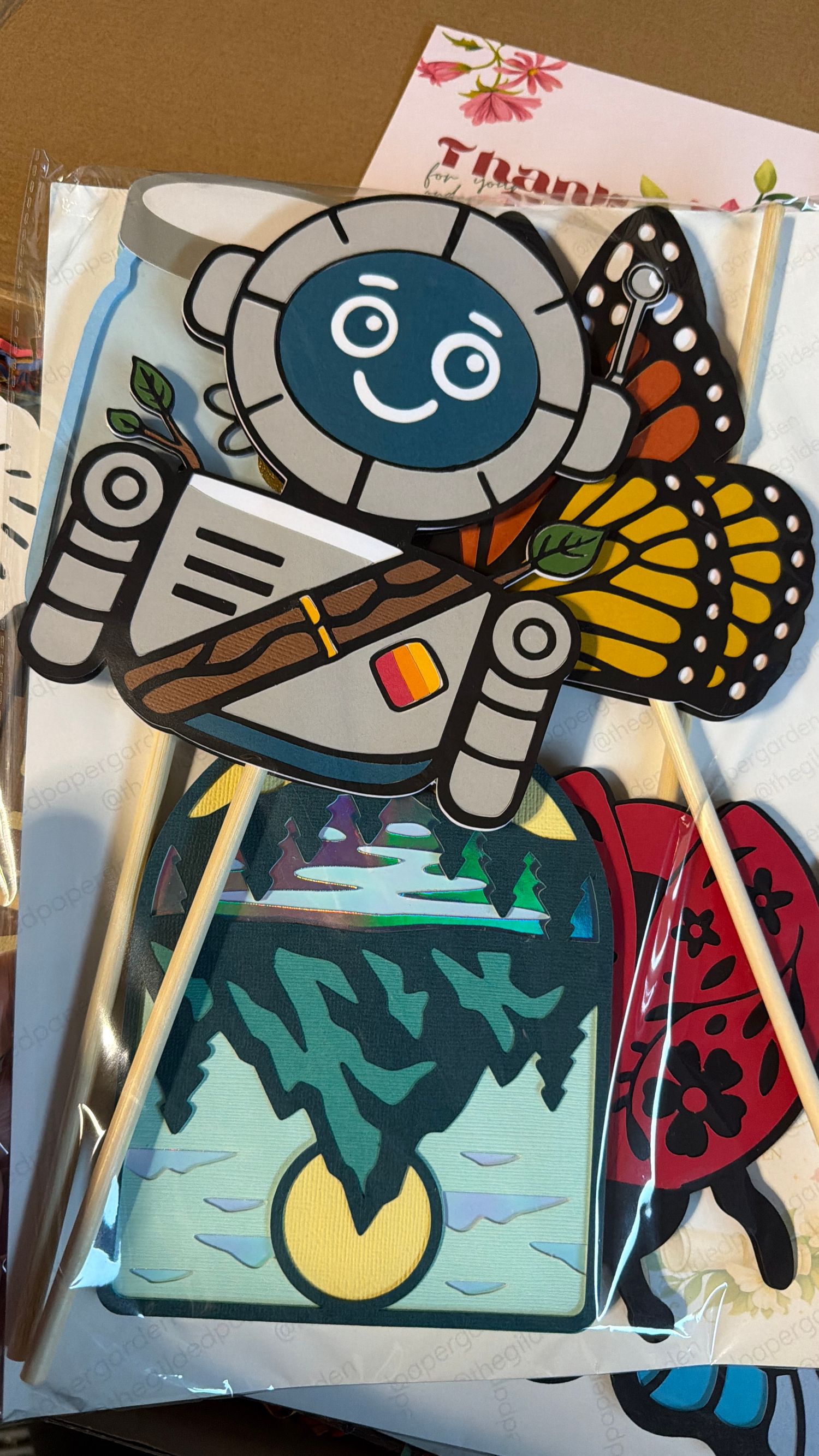 Handmade custom photo booth props for Crusoe, including the chatbot mascot.