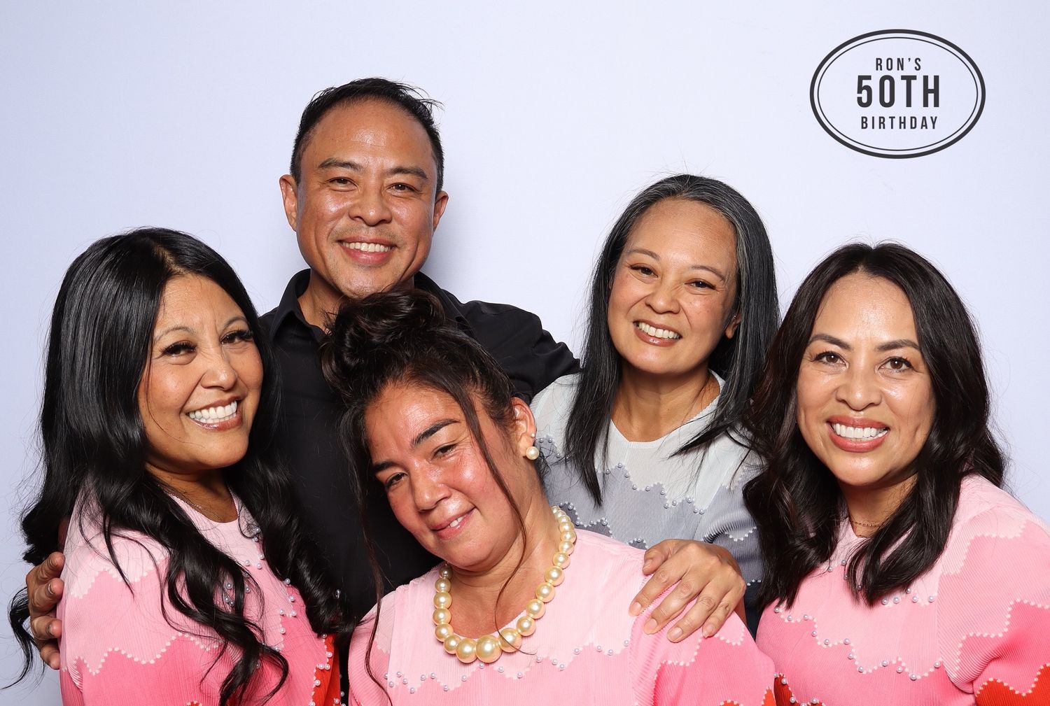 Group of five smiling people posing at a 50th birthday photo booth celebration. Industrious, Walnut Creek.