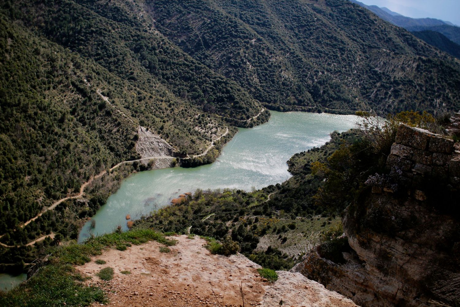 A river in sunlight near Margalef Spain by Cat Heygate Photo