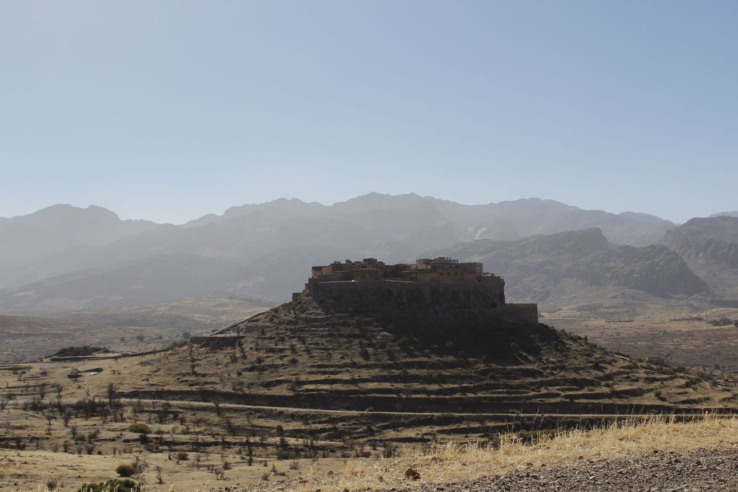 Landscape photo of a fort in Morocco early morning light by Cat Heygate Photo