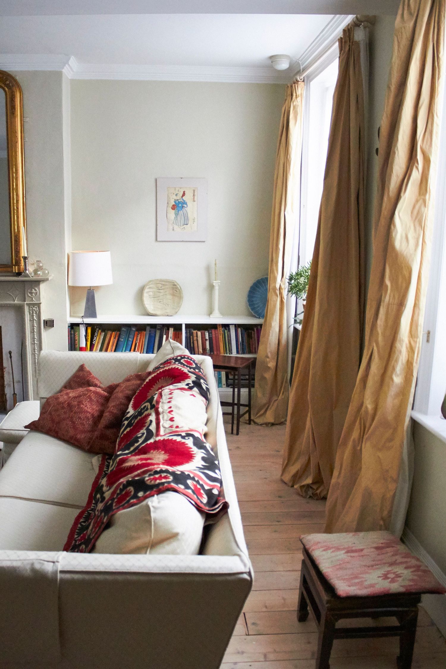 Interior photography of living room with taffeta curtains and textiles in natural light by Woodbridge photographer Cat Heygate Photo