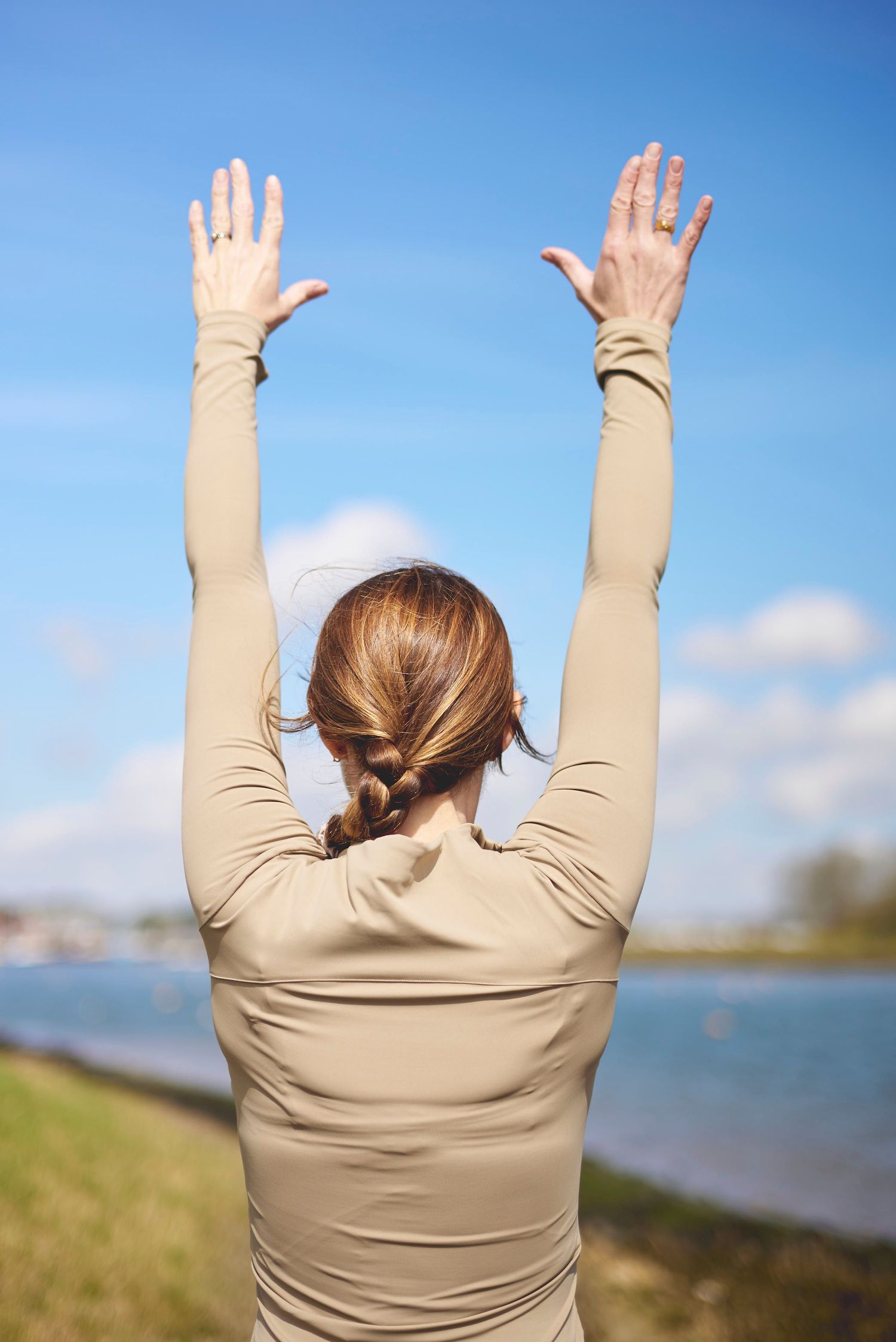 Pilates instructor stretching outdoors in Woodbridge during a brand photoshoot