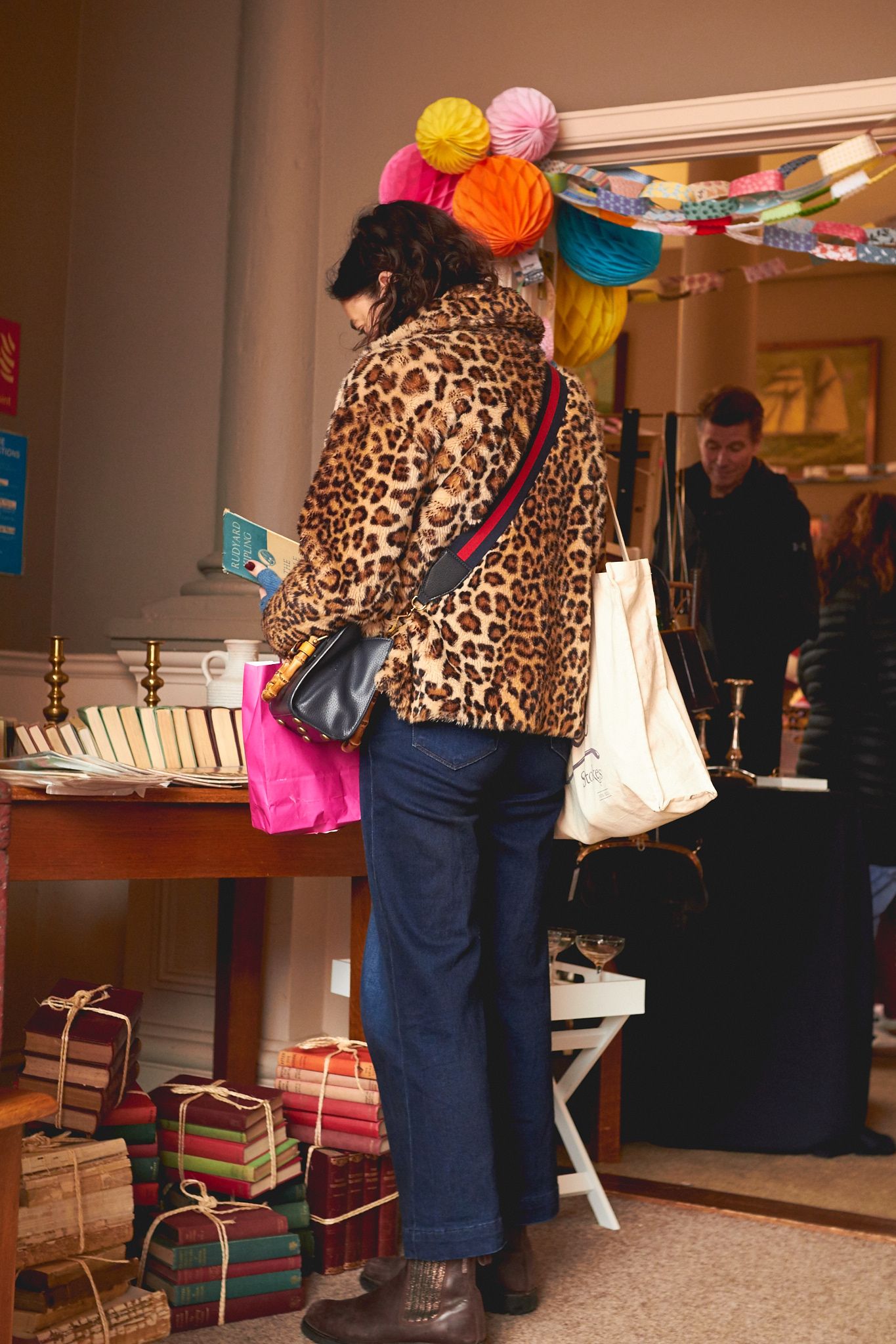 Woman browsing clothing at the Deben Events vintage market in Woodbridge during a brand photoshoot